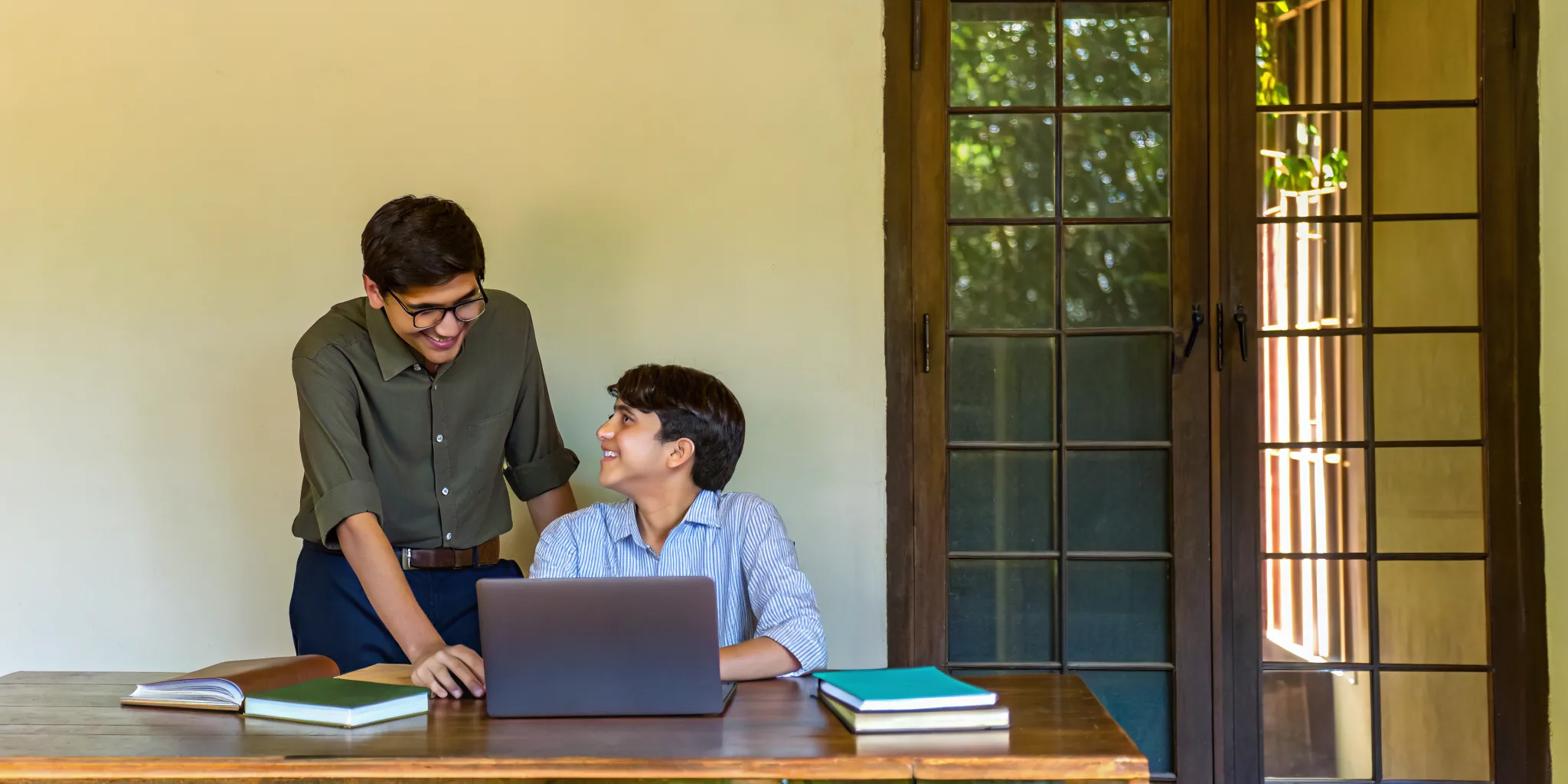 Tutor providing academic coaching to build executive function skills and study habits