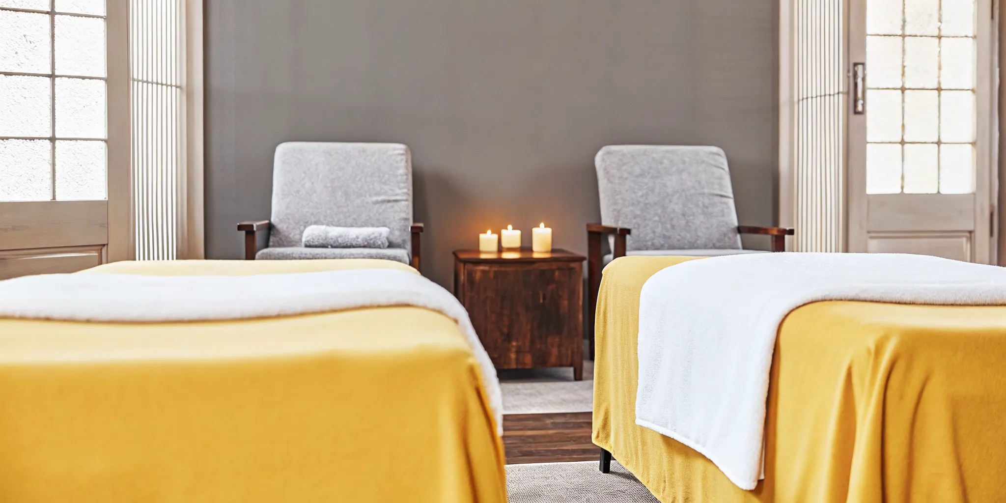 Peaceful massage therapy studio interior in New Orleans with warm earth tones and inviting treatment table