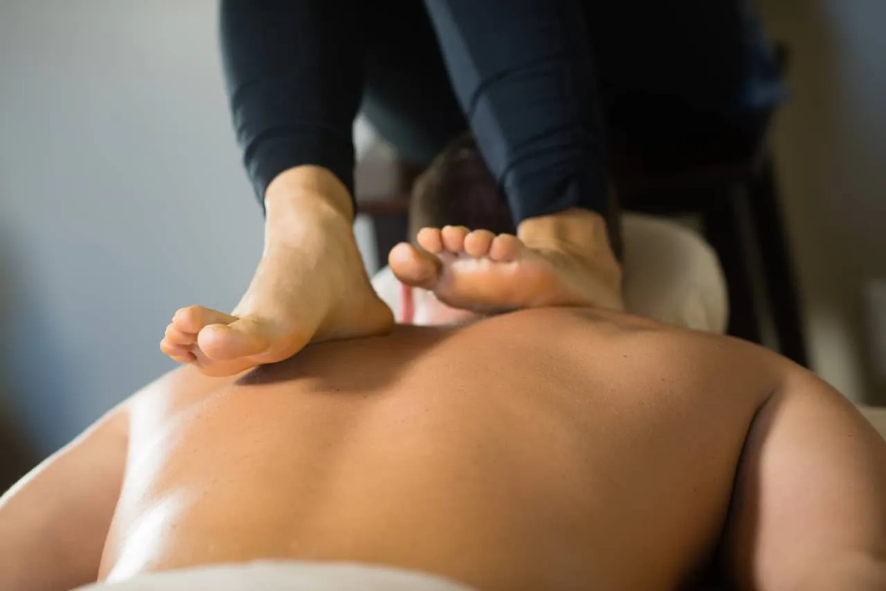Ashiatsu Deepfeet Bar Therapy during a massage in New Orleans