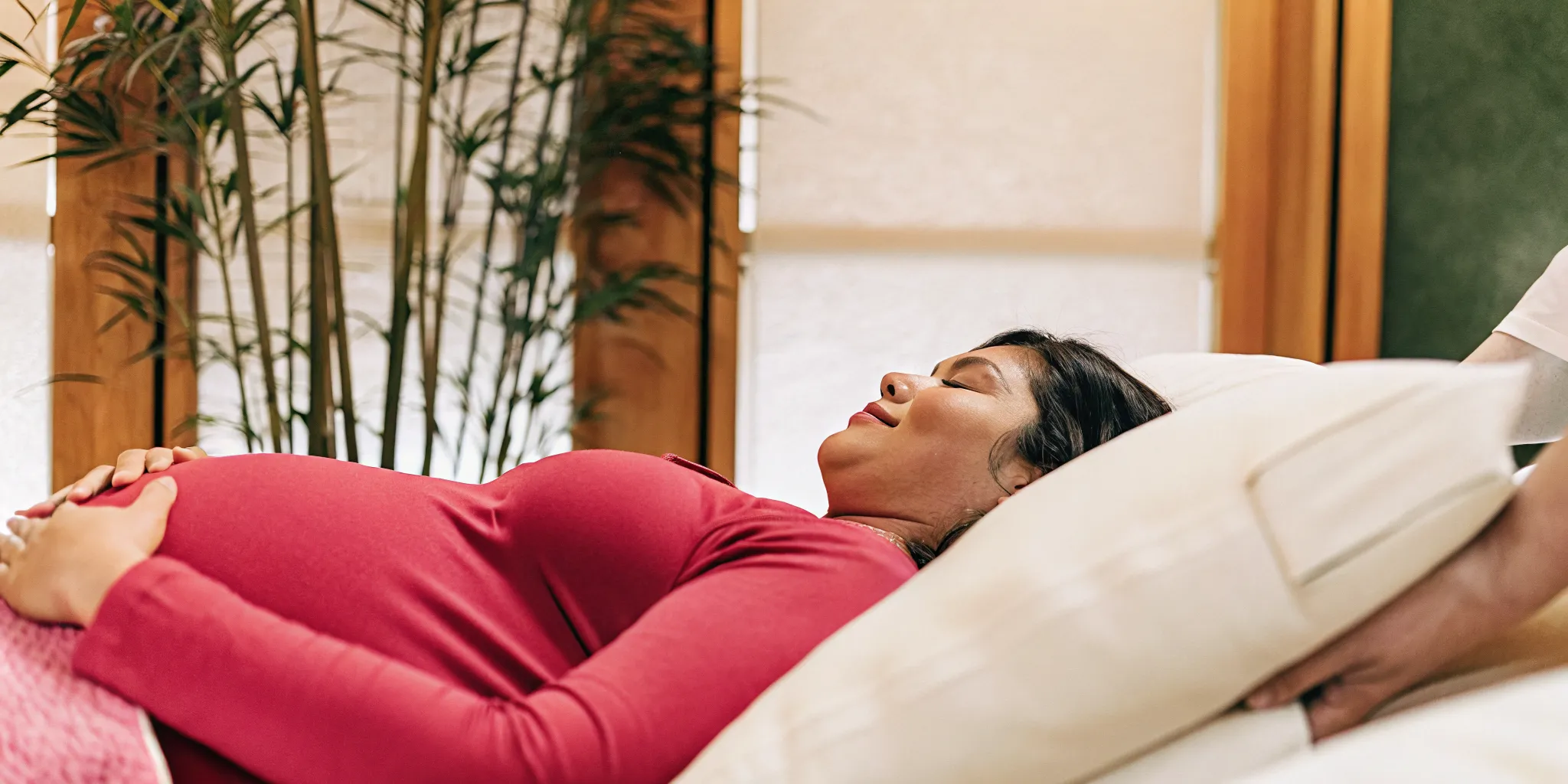 Prenatal massage session with supportive side-lying pillows