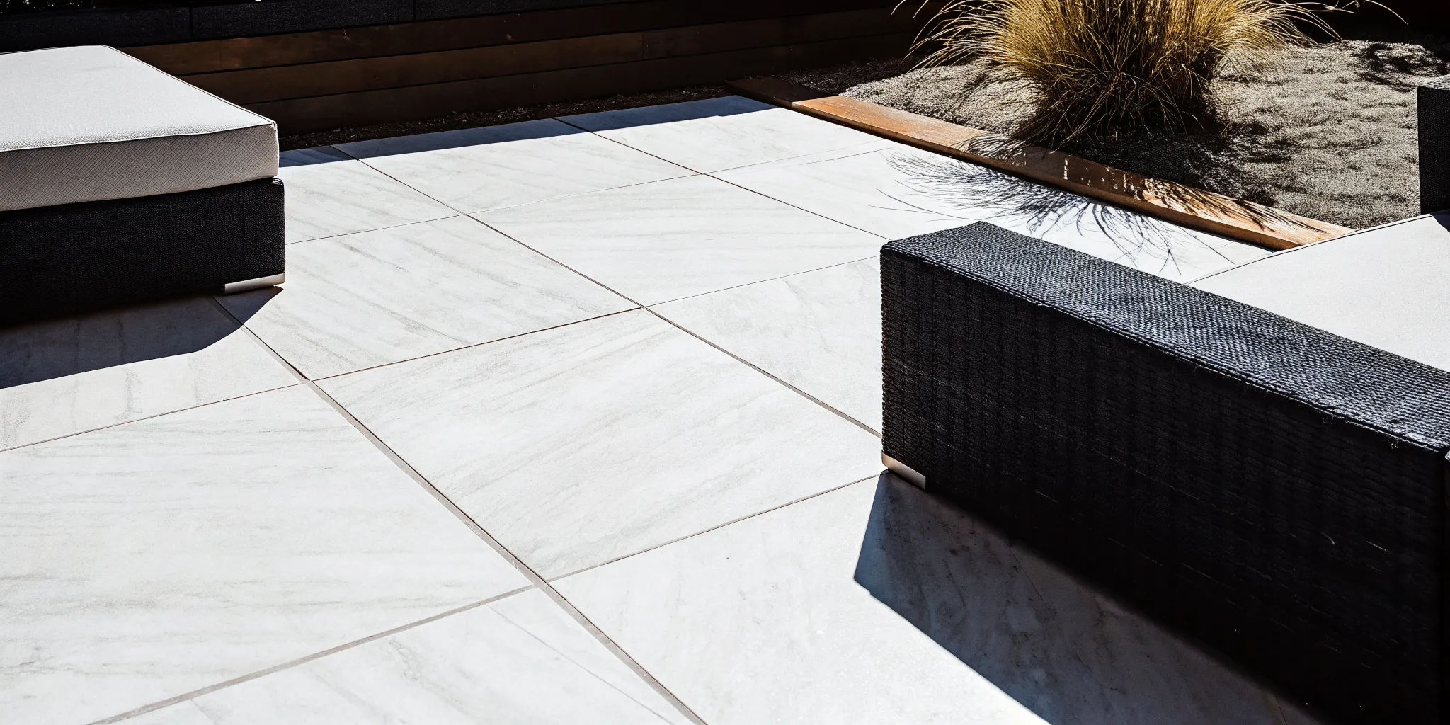 Modern stone-look porcelain paver installation on a Long Island patio