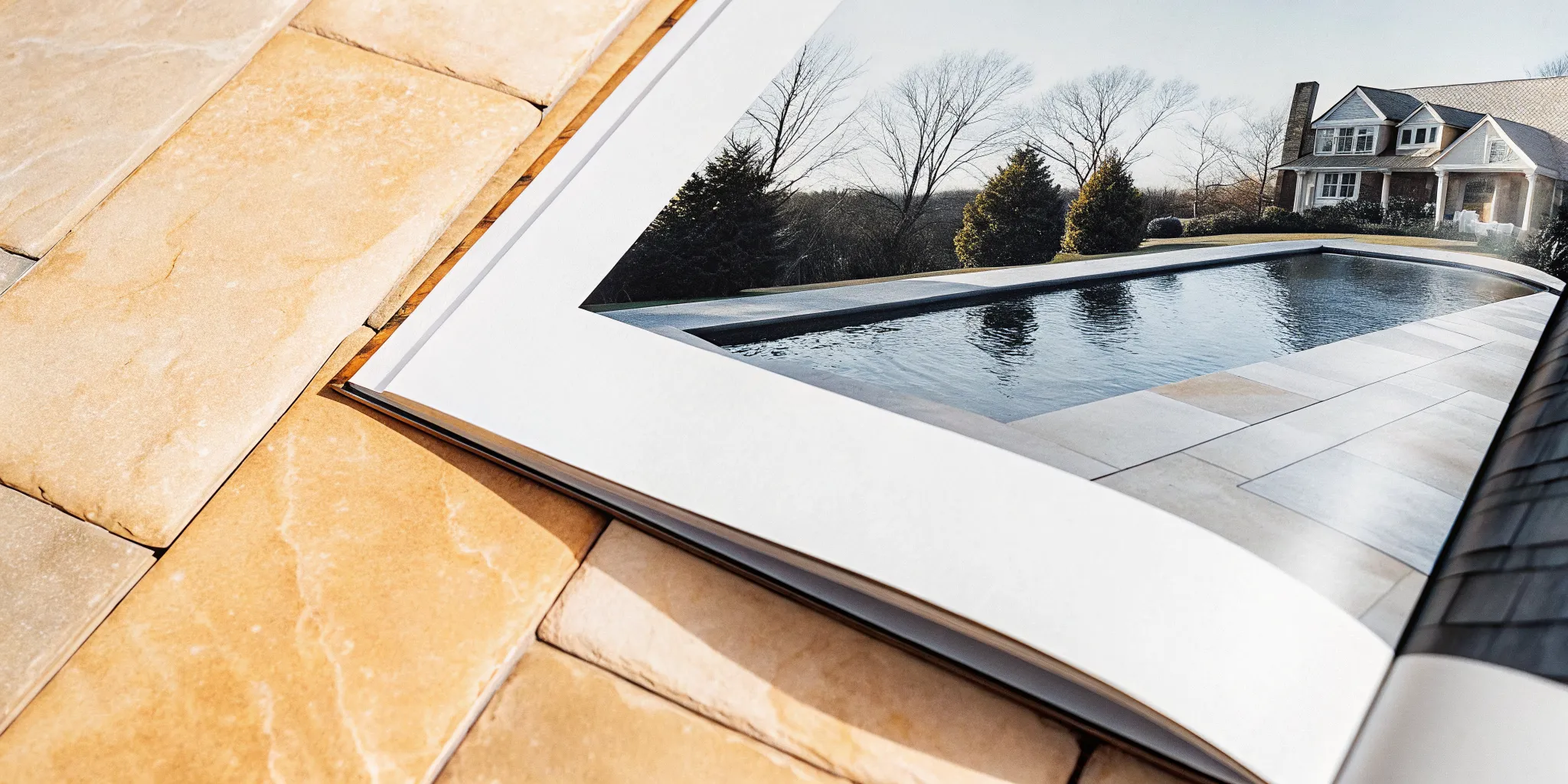 Natural stone pool coping material at a Long Island backyard pool