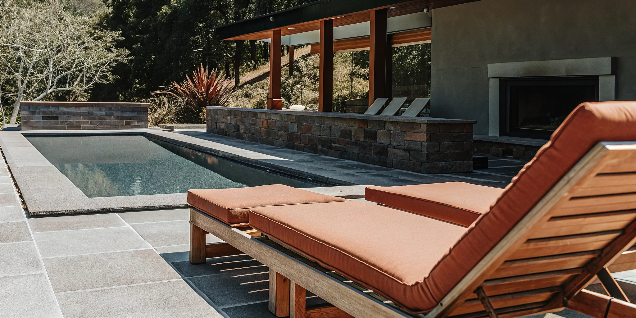 Natural travertine pavers around a Long Island swimming pool