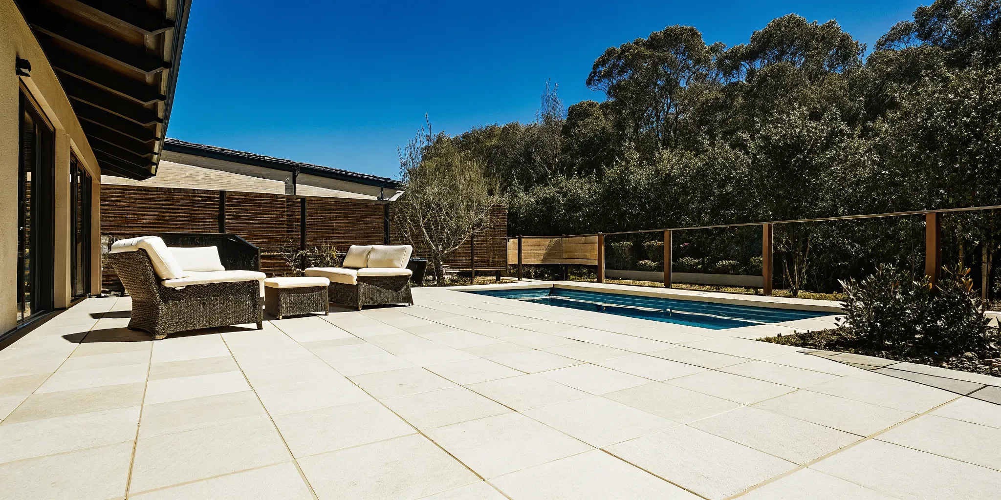 A modern porcelain patio installation featuring Italian stone-look porcelain pavers on Long Island