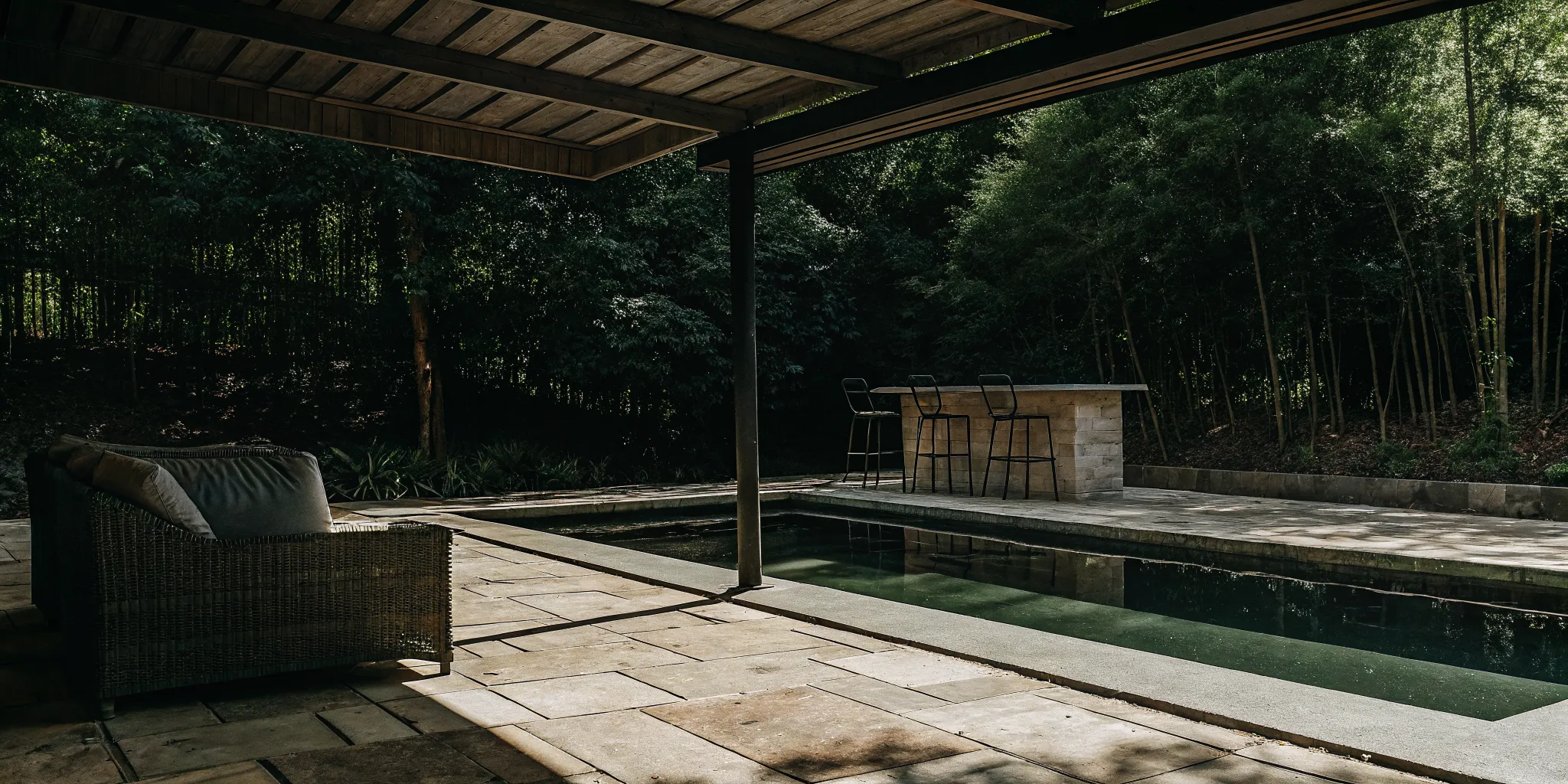 A custom louvered pergola and solid roof pavilion next to a Long Island swimming pool
