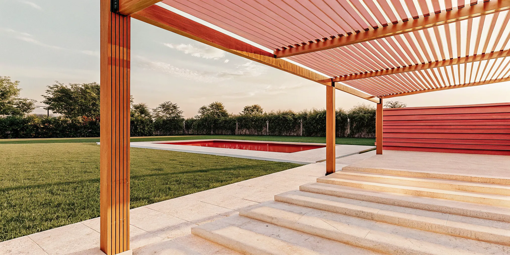 Louvered aluminum pergola beside a Long Island pool and stone patio