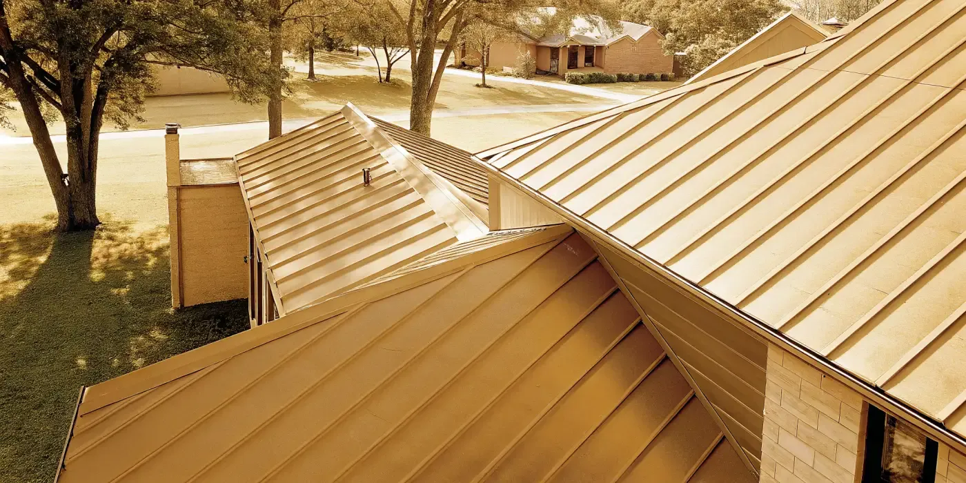Texas home with a dark standing seam metal roof