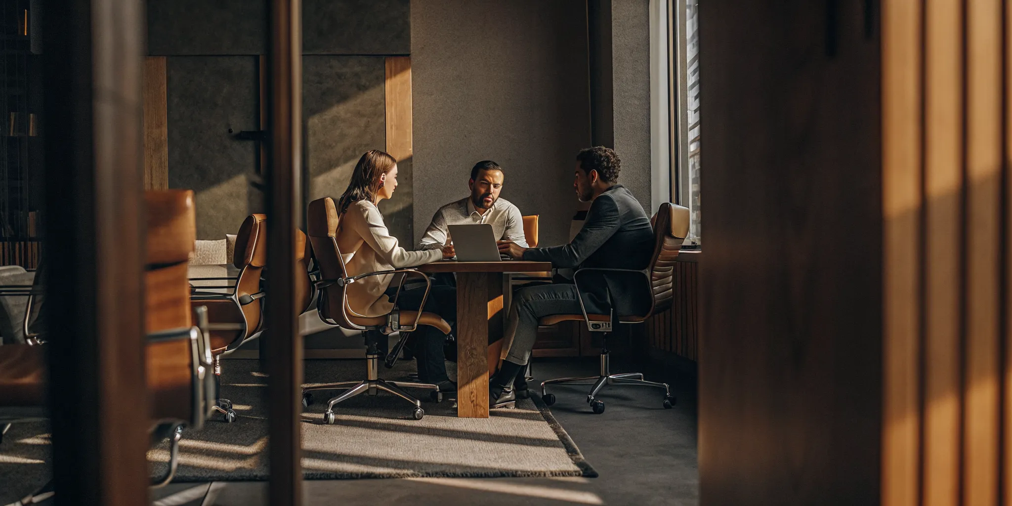 Two MSP business owners reviewing hiring strategy with an operations consultant