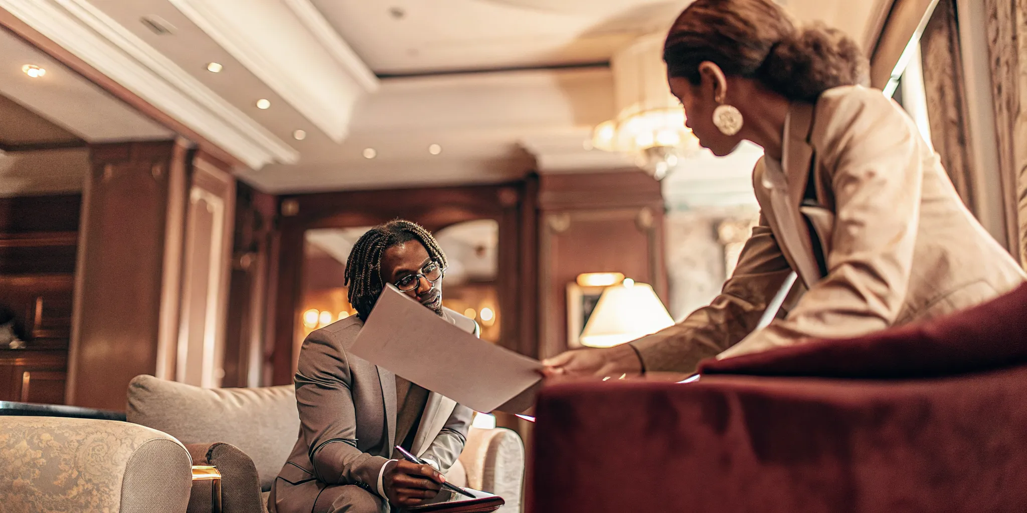 Real estate advisor consulting with a client in a luxury office about 1031 exchange service
