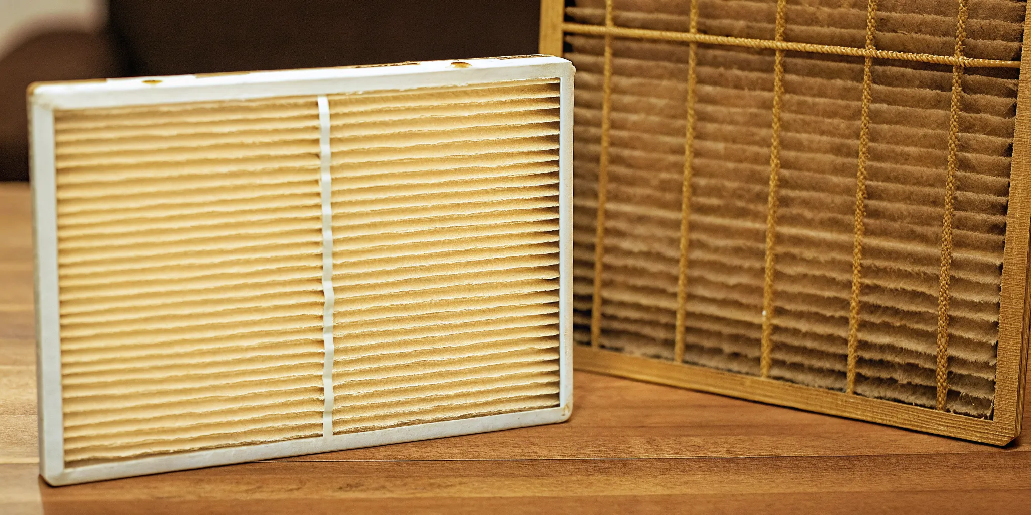 Comparison of clean and dirty HVAC air filters showing when to replace