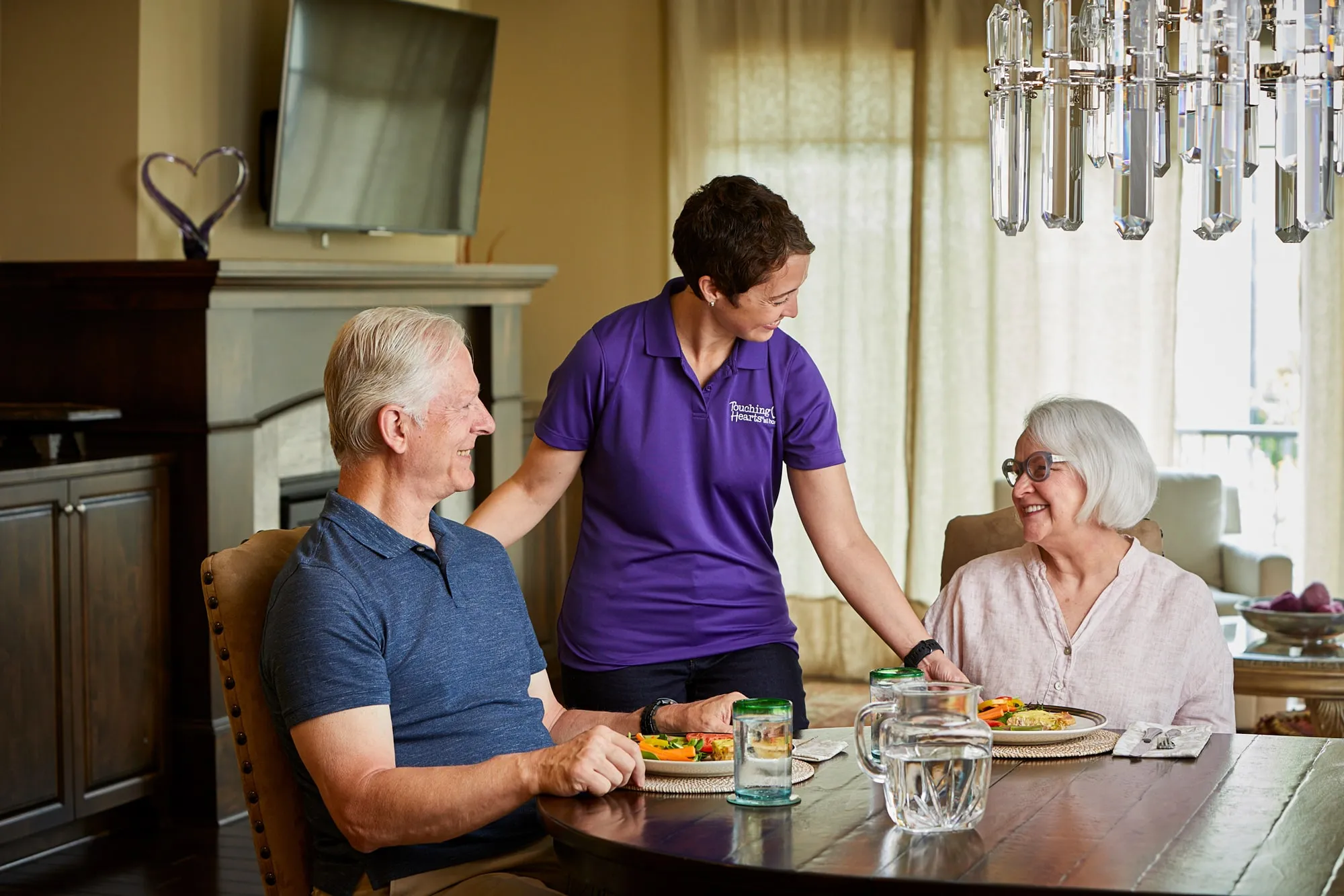 Touching Hearts at Home caregiver spending time with a senior