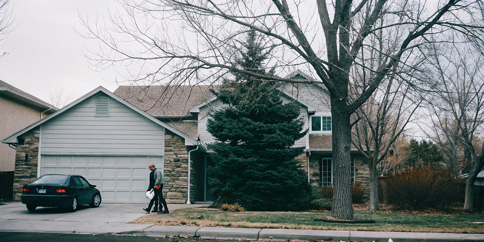 Caregiver providing safe mobility support for an adult with multiple sclerosis at home