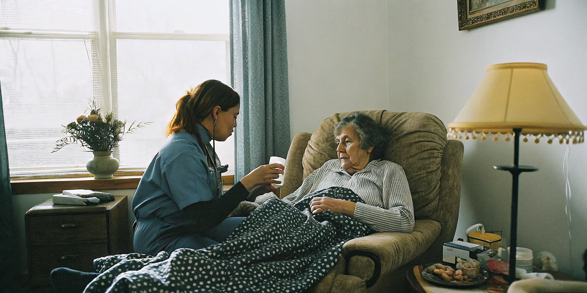 Senior woman recovering at home with a caregiver providing transitional care support after a hospital discharge in Aurora Colorado