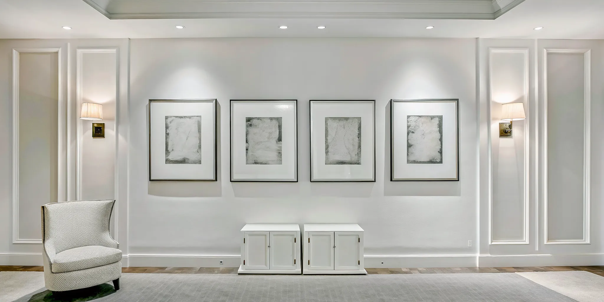 curated collection of framed artworks arranged at eye level in a residential gallery hall