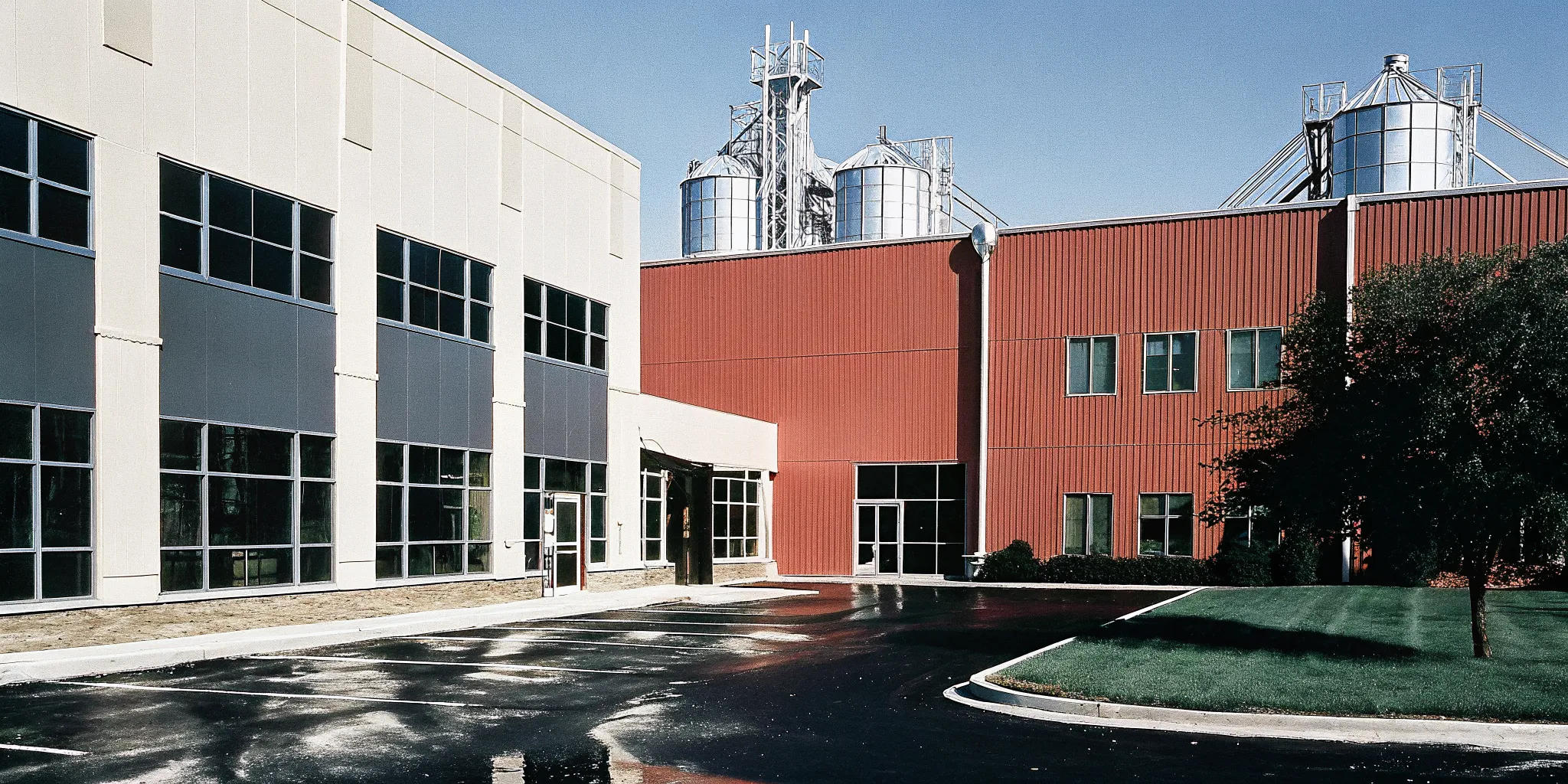 Modern commercial office building and manufacturing facility exterior representing Iowa business property tax considerations