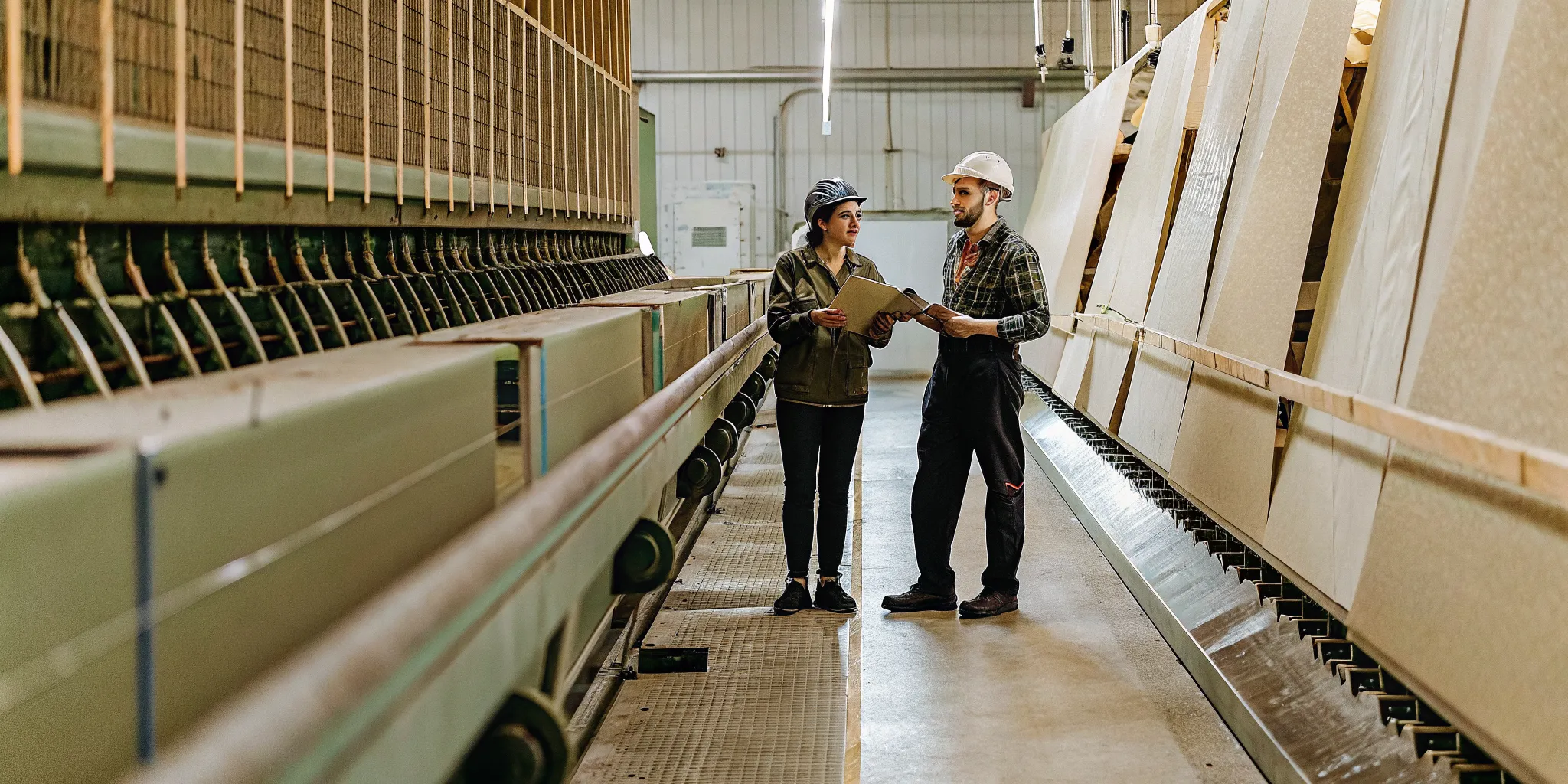 Finance and operations leaders reviewing manufacturing property tax exposure in an industrial facility