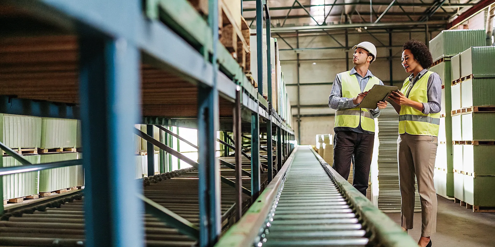 Warehouse managers reviewing racking and equipment for a property tax assessment