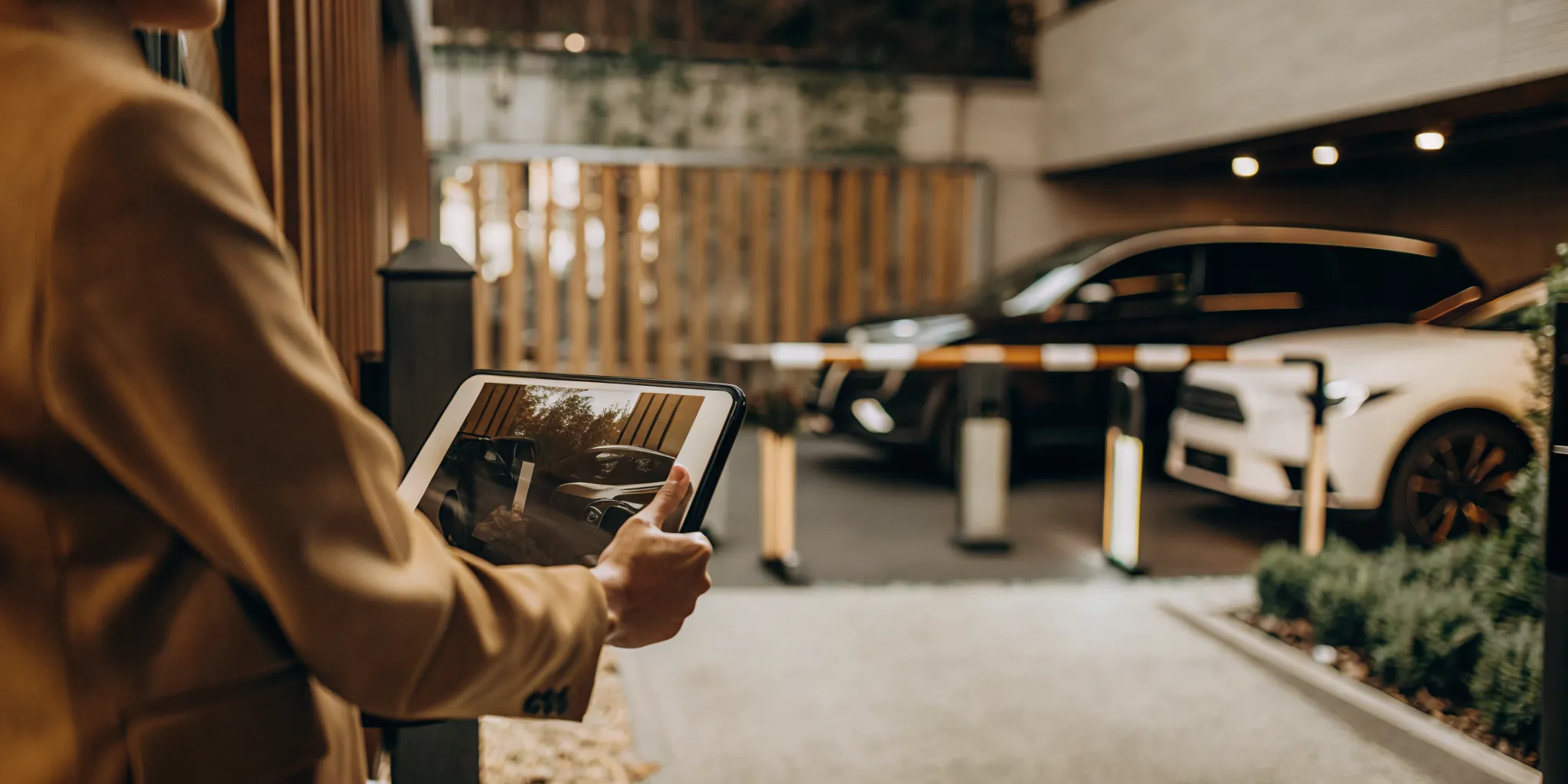 Property manager using digital parking management tools on a tablet