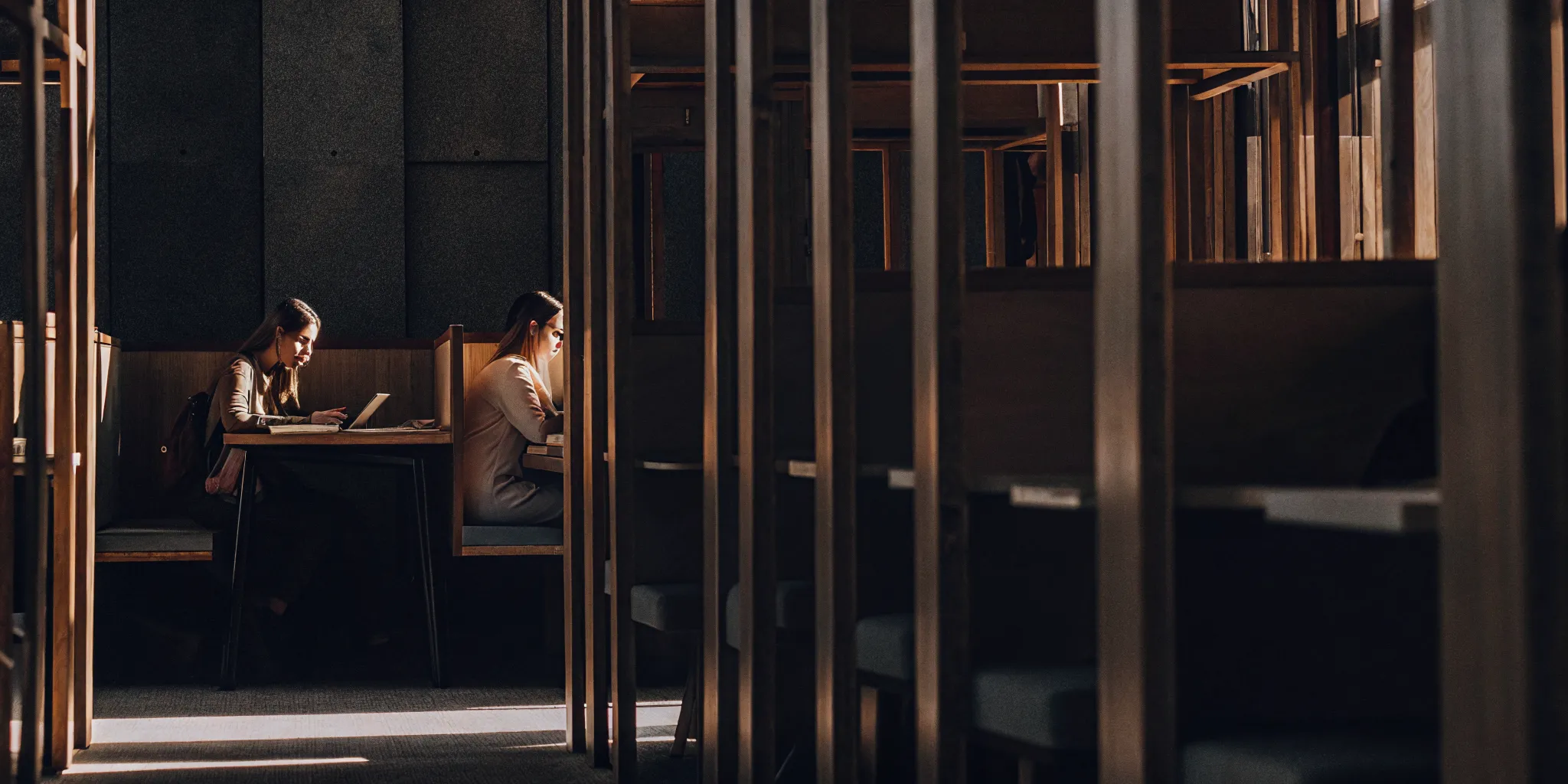 Students using collaborative and quiet study spaces in off-campus housing
