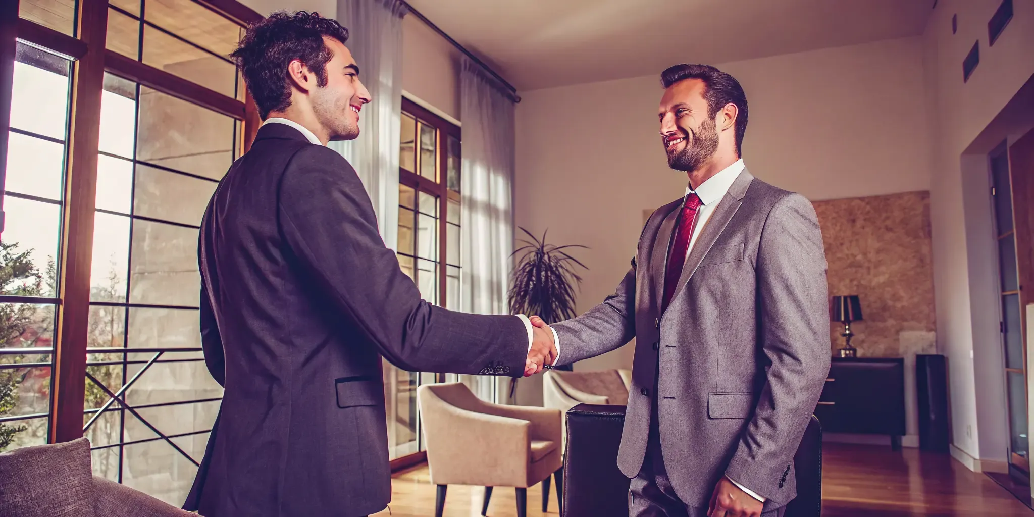 Lawyer handshake with client in a bright office emphasizing ethical litigation funding