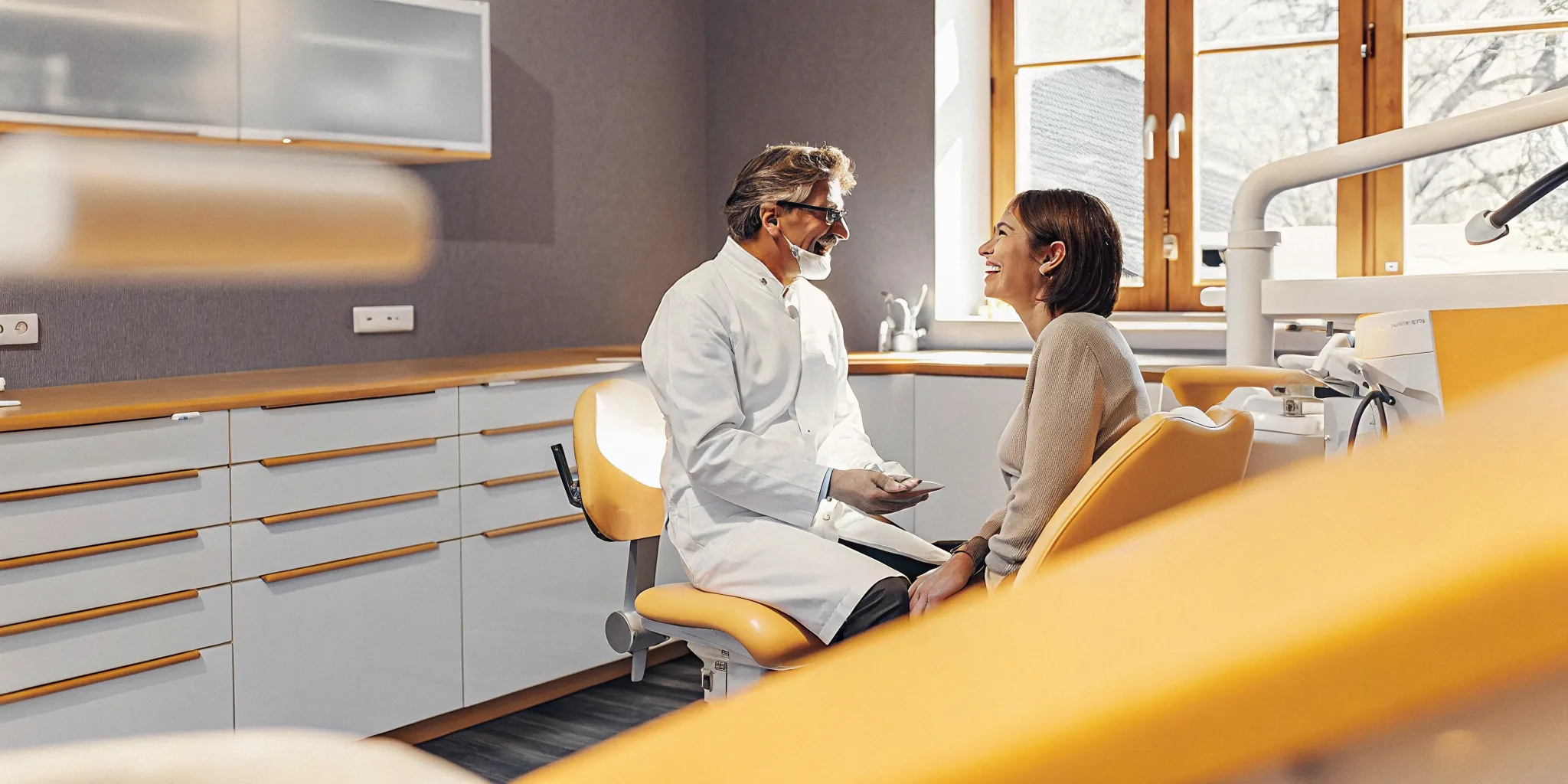 Dentist discussing dental payment plans with a patient in Lowell MA