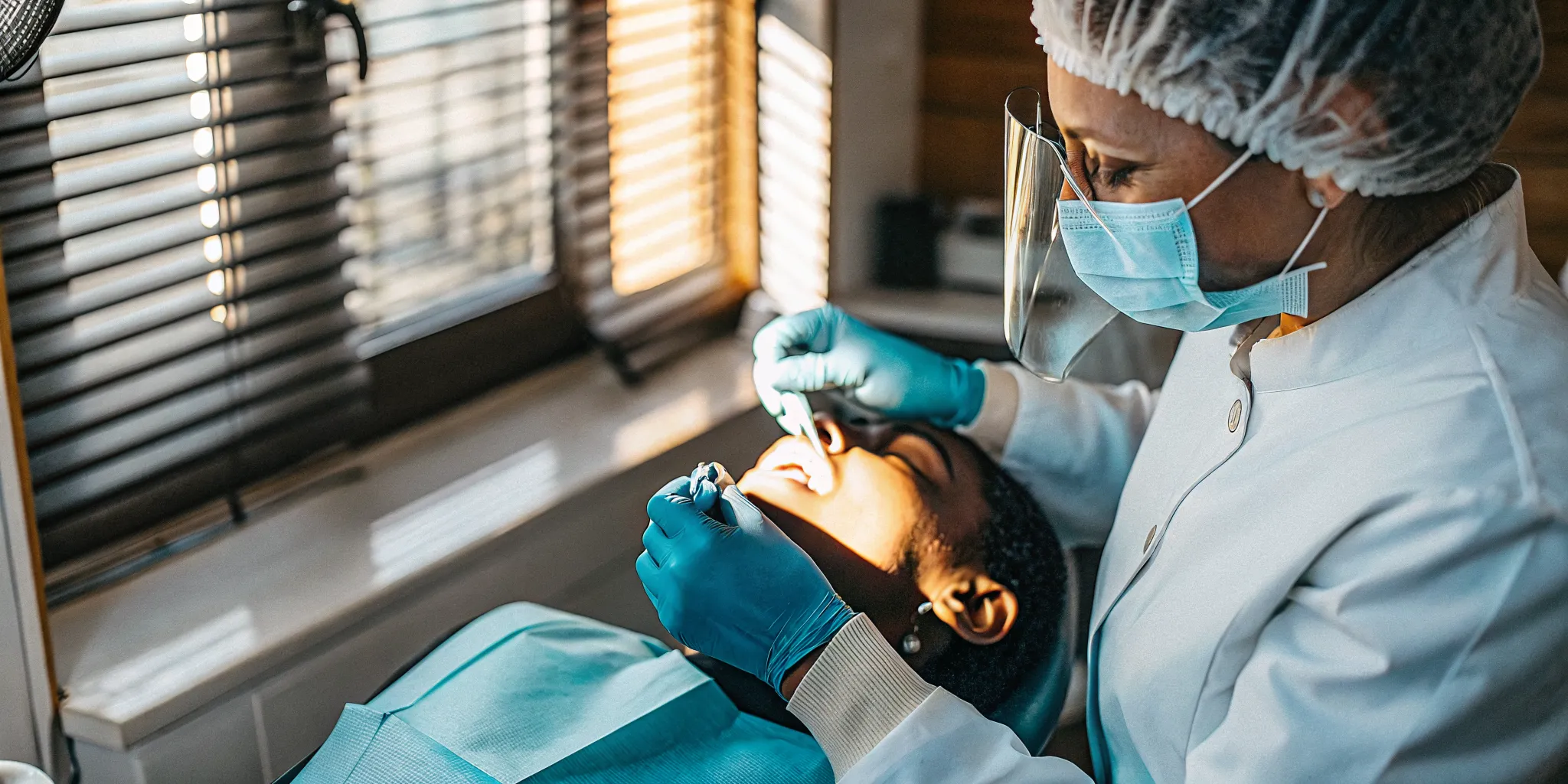Dental implant procedure being performed in a modern dental office