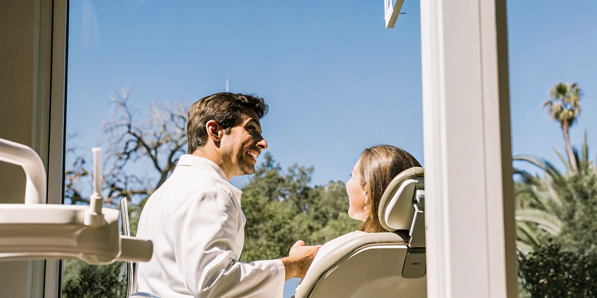 Dentist discussing a Saturday dental visit with a patient in Lowell
