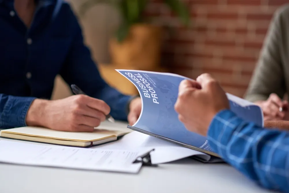 Investment planning documents and growth charts on a desk representing high-return investment strategies