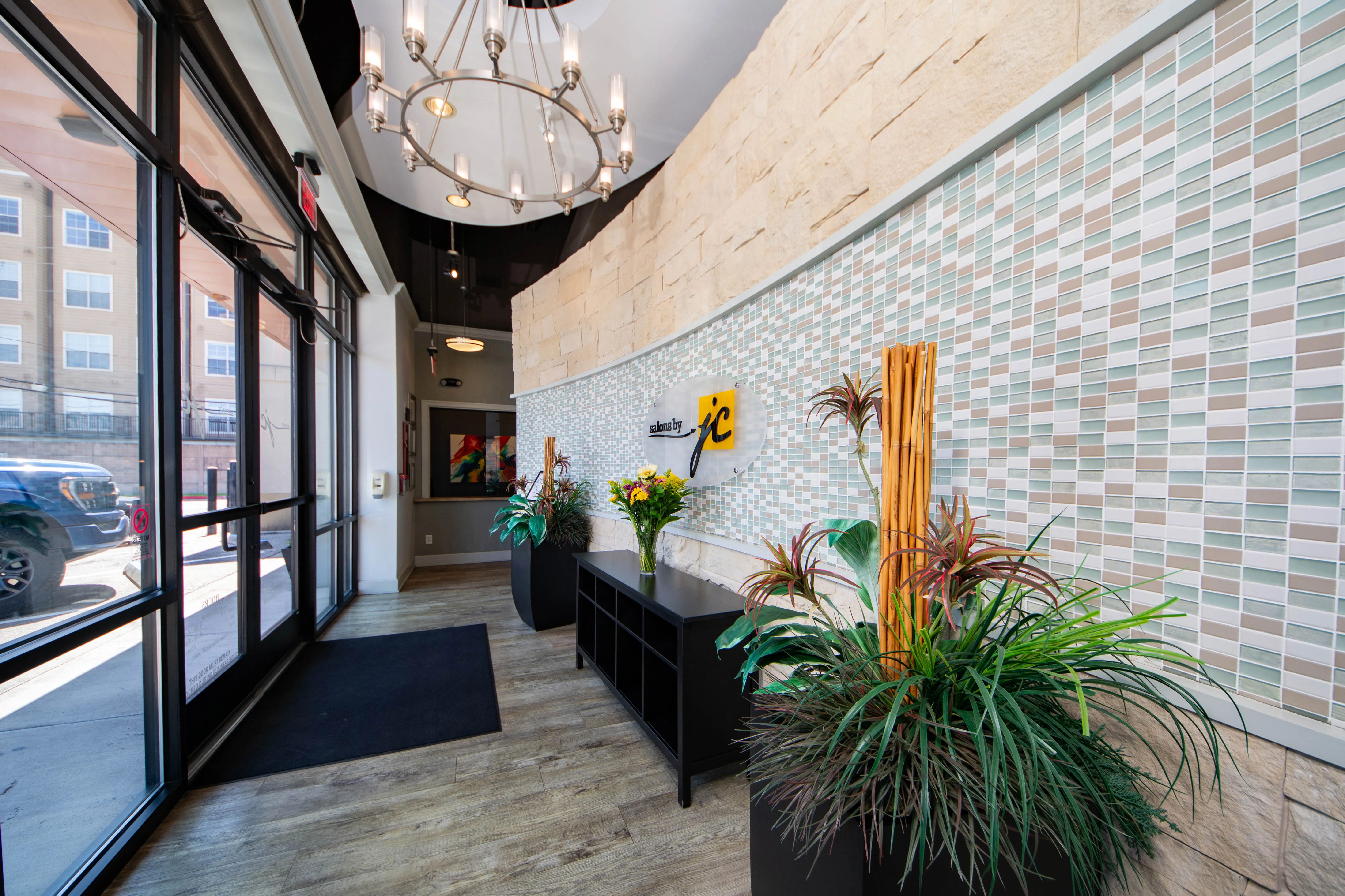 Modern salon suite lobby and reception area at Salons by JC showing a welcoming, professional environment for beauty professionals and clients
