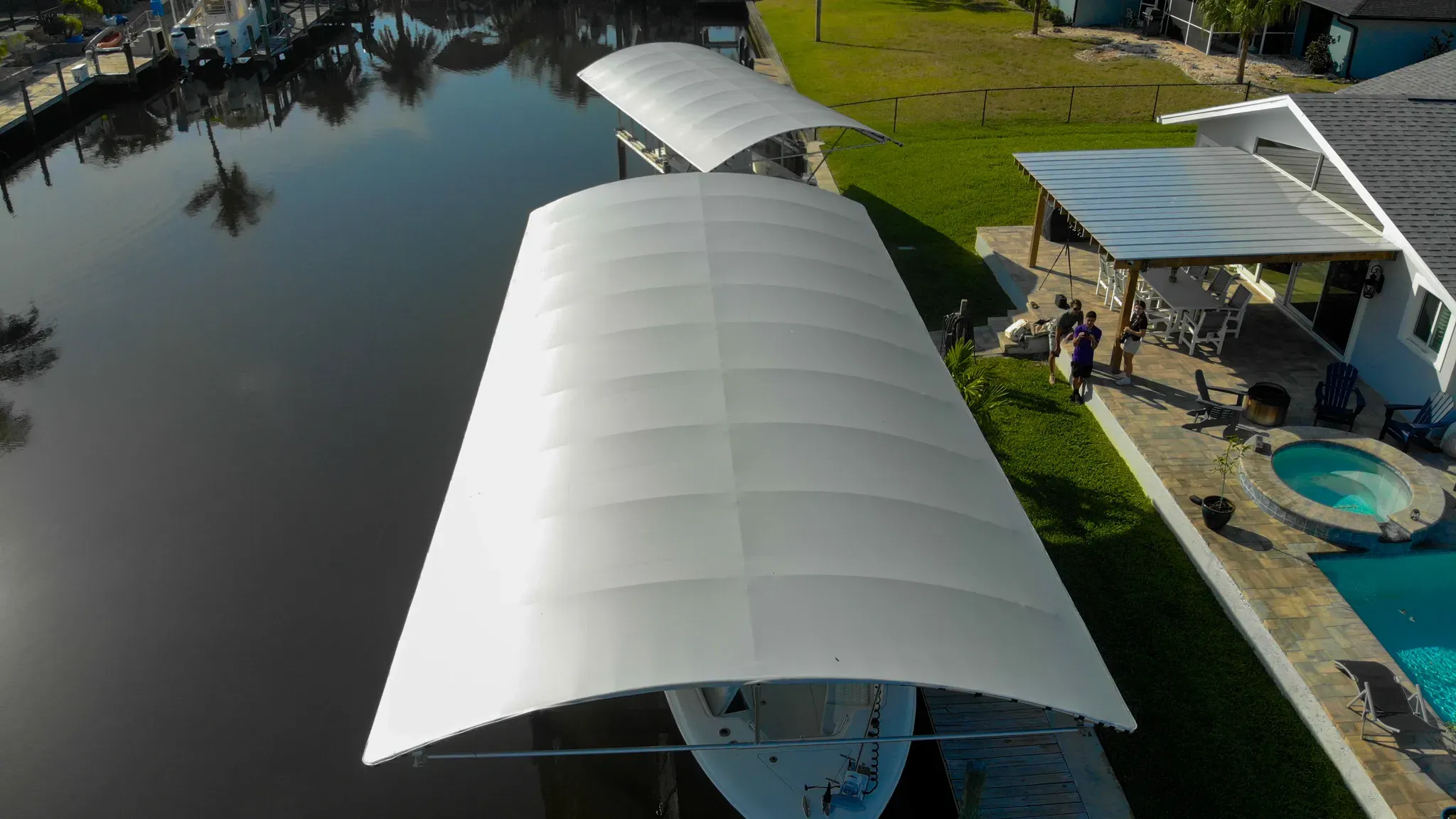 Boat lift canopy system installed on a waterfront dock in Southwest Florida