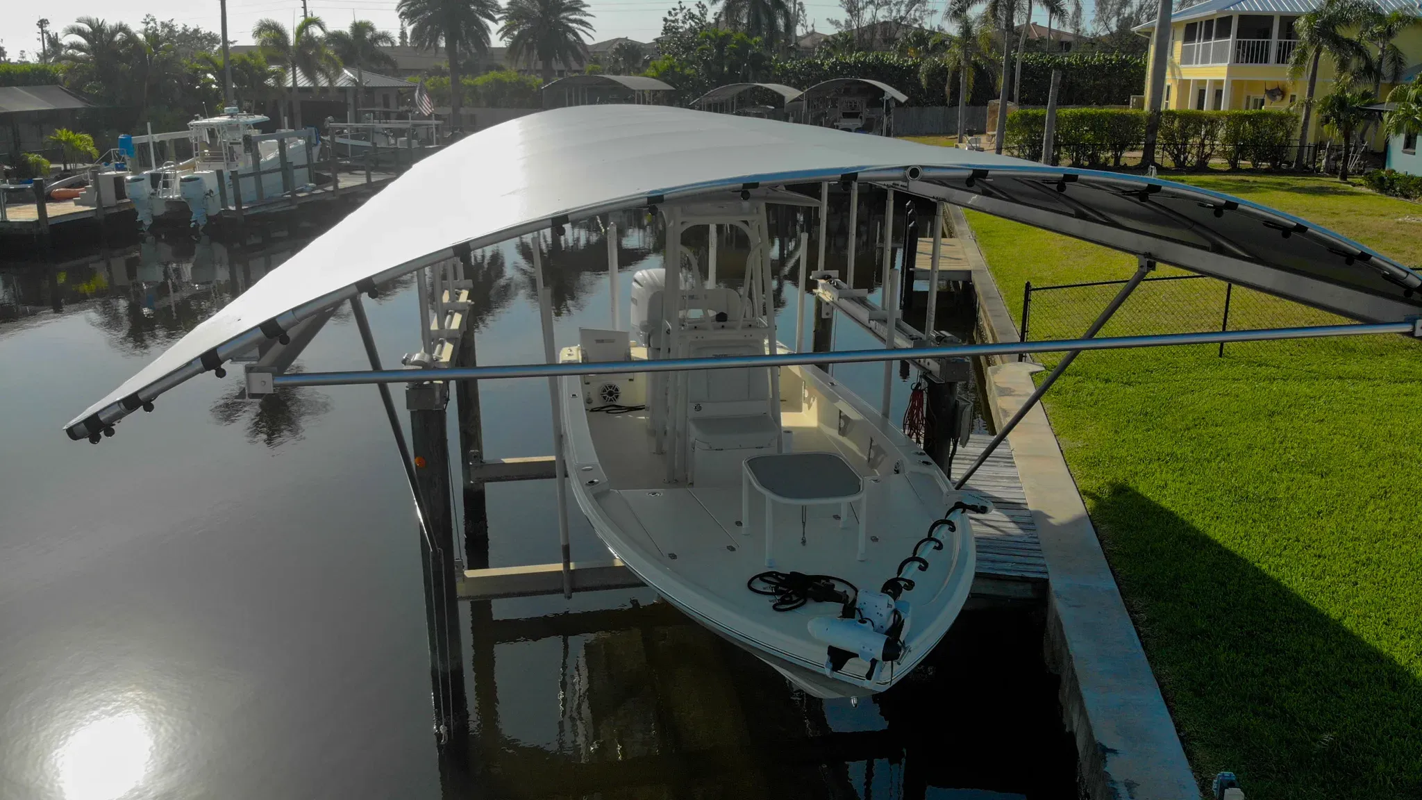 Boat lift canopy providing shade and protection at a Florida waterfront dock