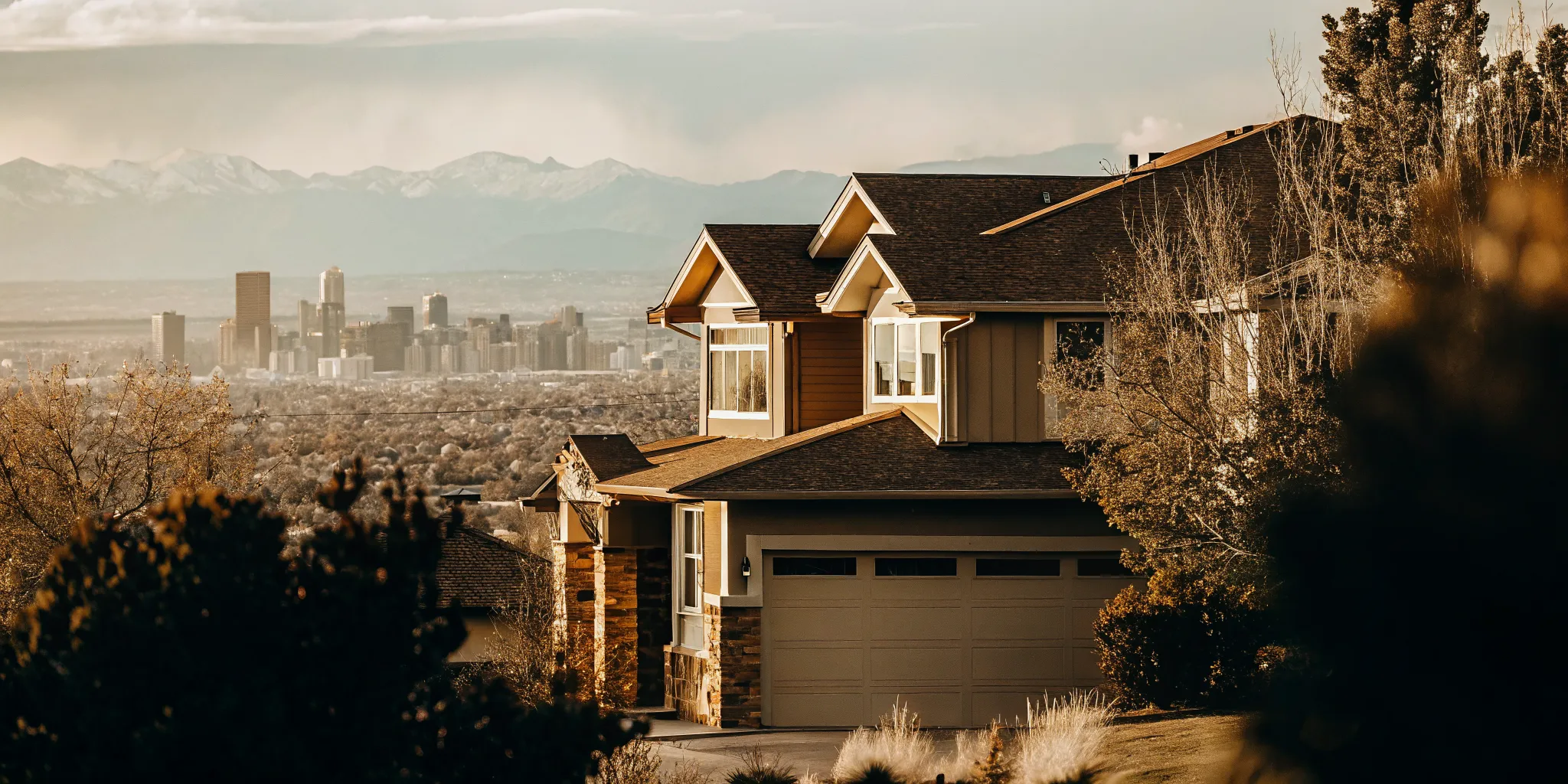 Modern suburban home in Colorado with Denver skyline and Rocky Mountains visible in the background