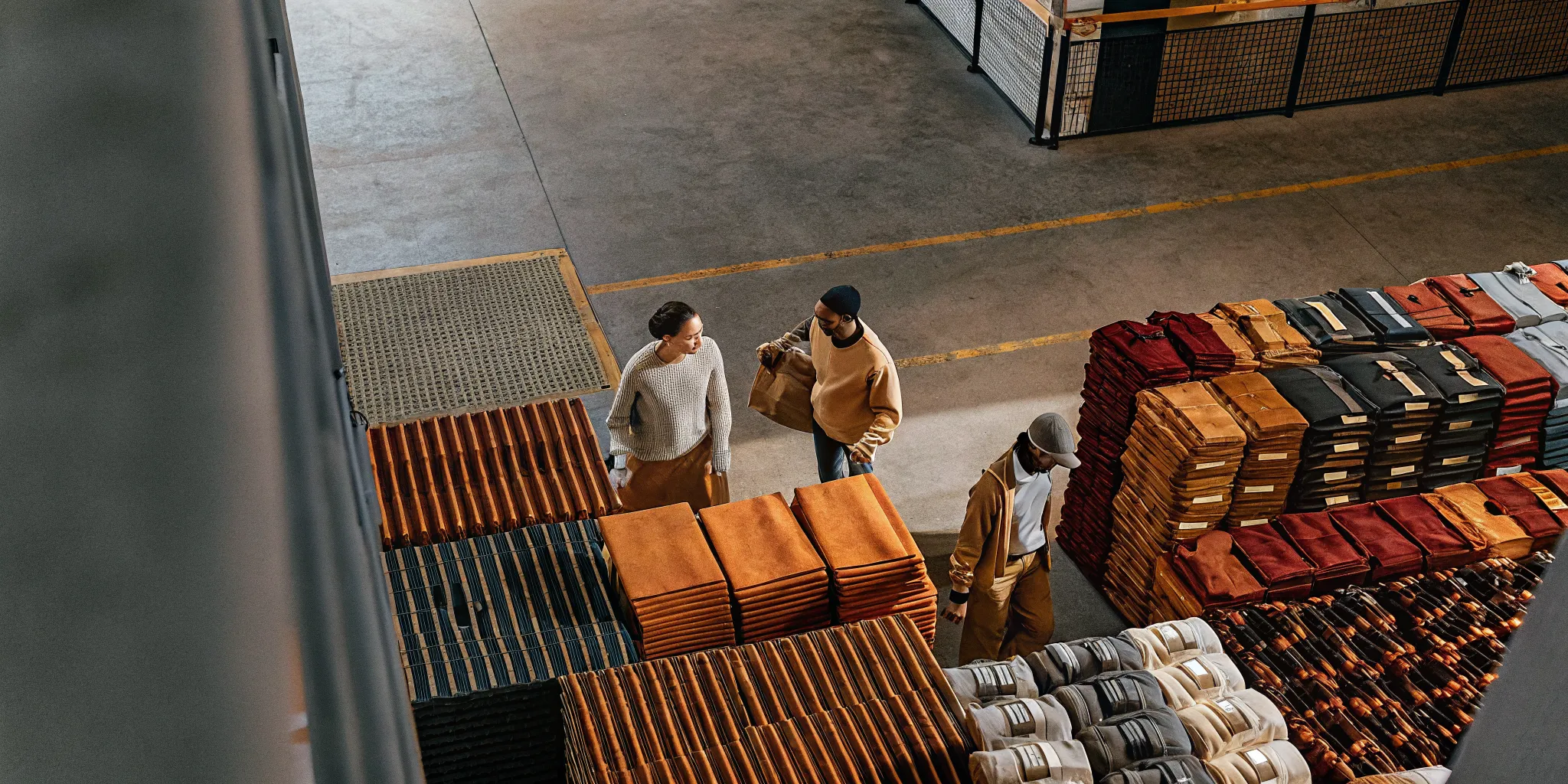 Company store fulfillment team organizing branded merchandise and employee kits