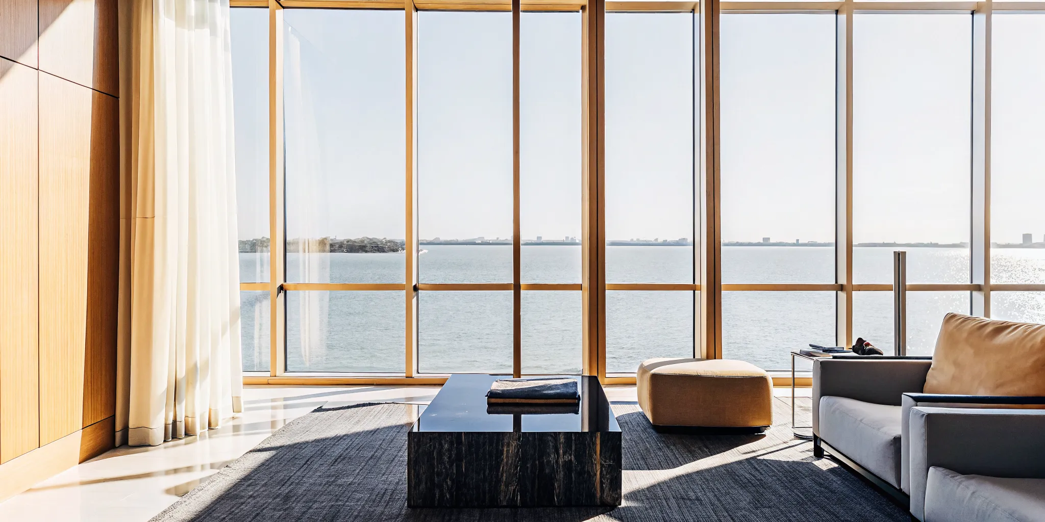 Luxury Miami condo interior with floor-to-ceiling windows overlooking Biscayne Bay