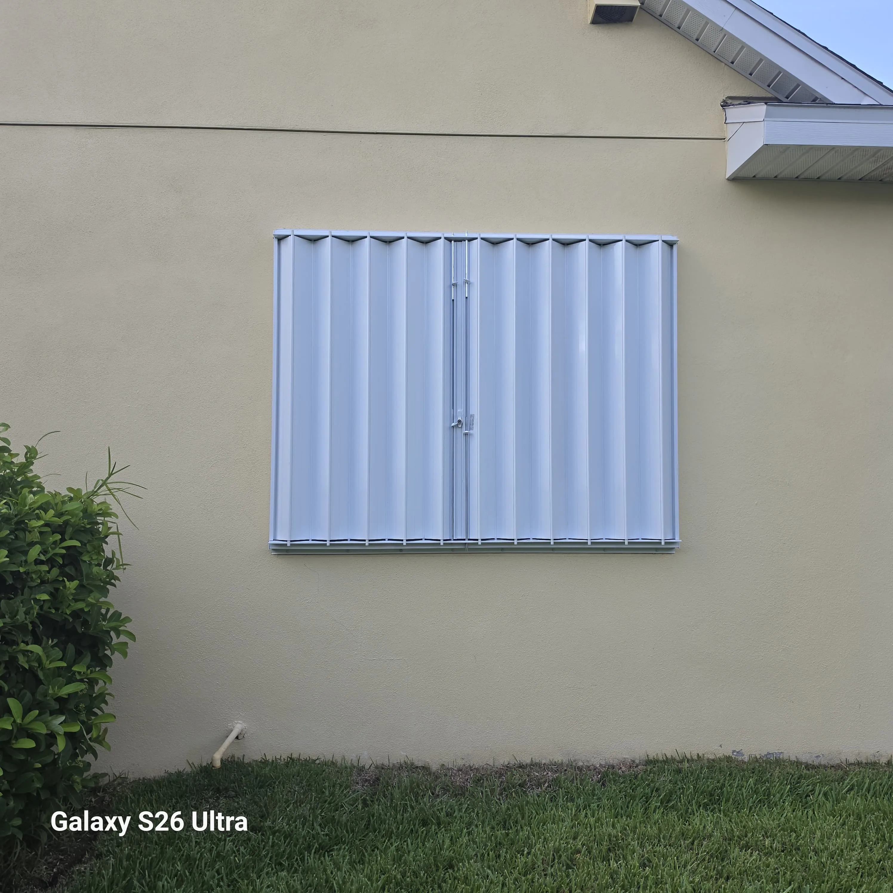 Accordion hurricane shutter installed on a home in Apollo Beach