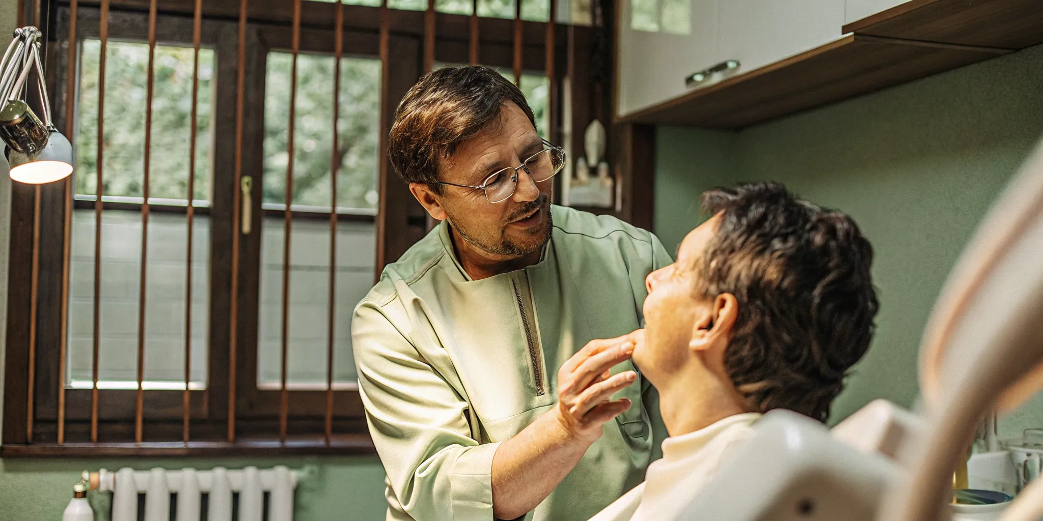 Patient discussing dental abscess treatment Melbourne FL with a dentist