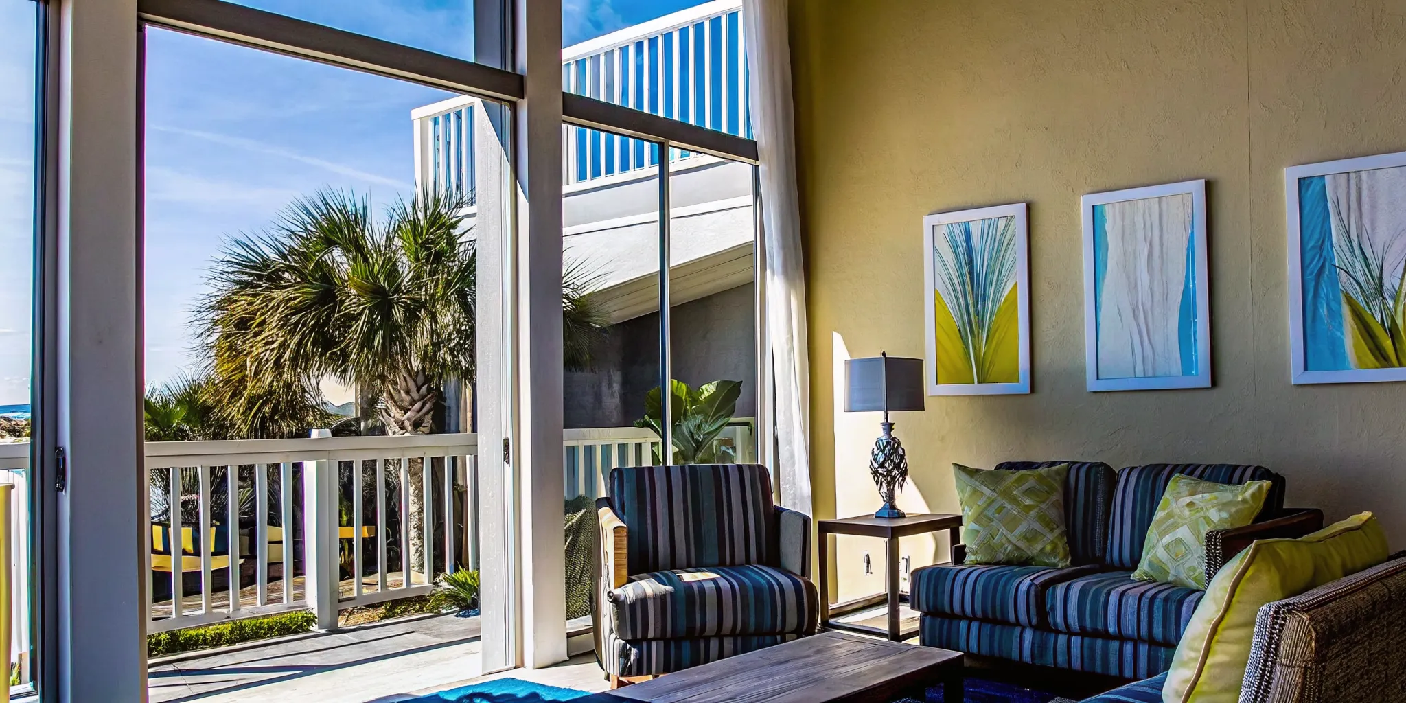 Bright coastal vacation rental living room in a Panama City Beach condo with modern decor and natural light