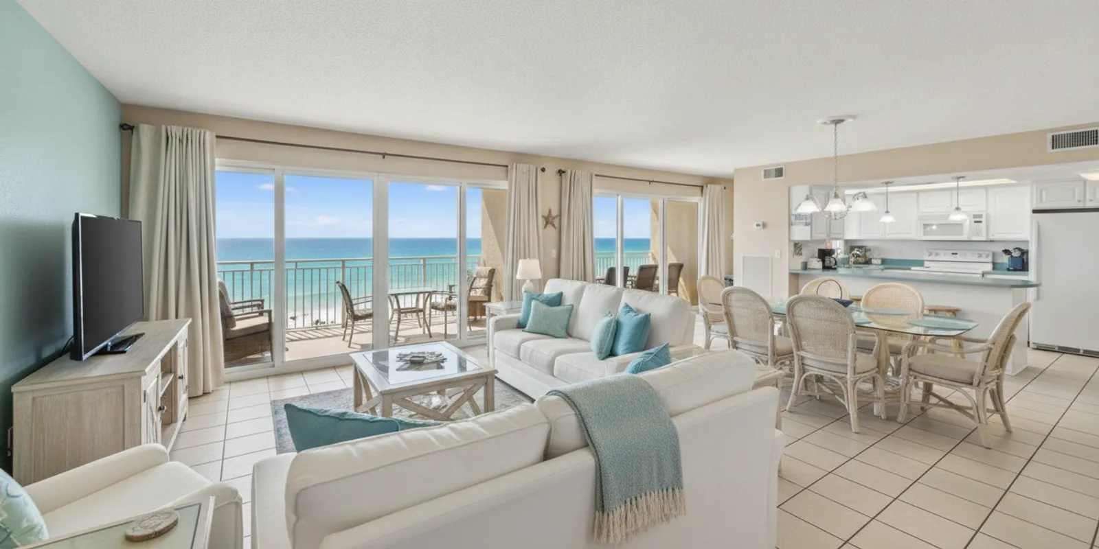 Bright vacation rental living room with a view of the Gulf in Panama City Beach