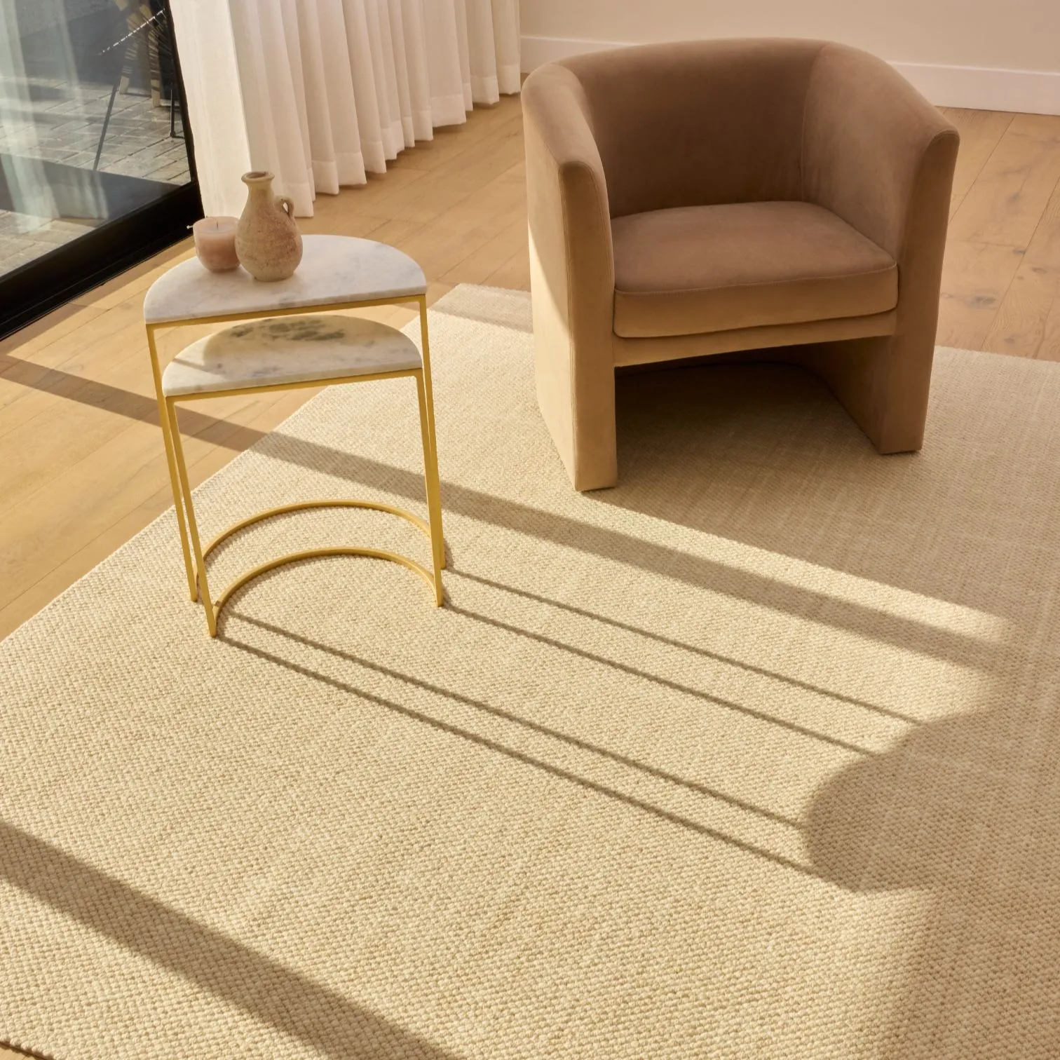 Luxury wool rug in a formal sitting room with a chair - Groundstory Estate collection