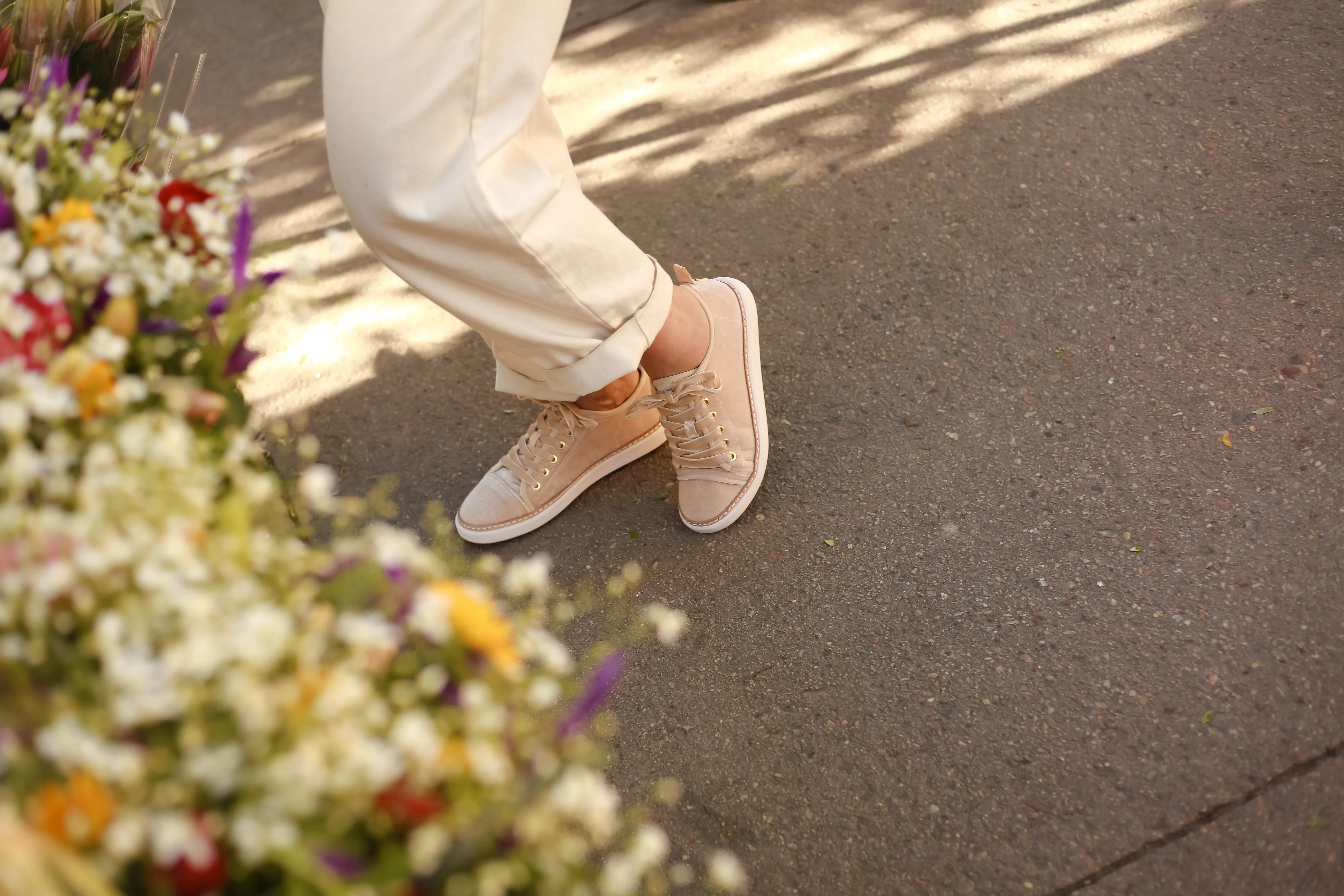 A person wearing grounding shoes while walking outdoors to support nervous system calm