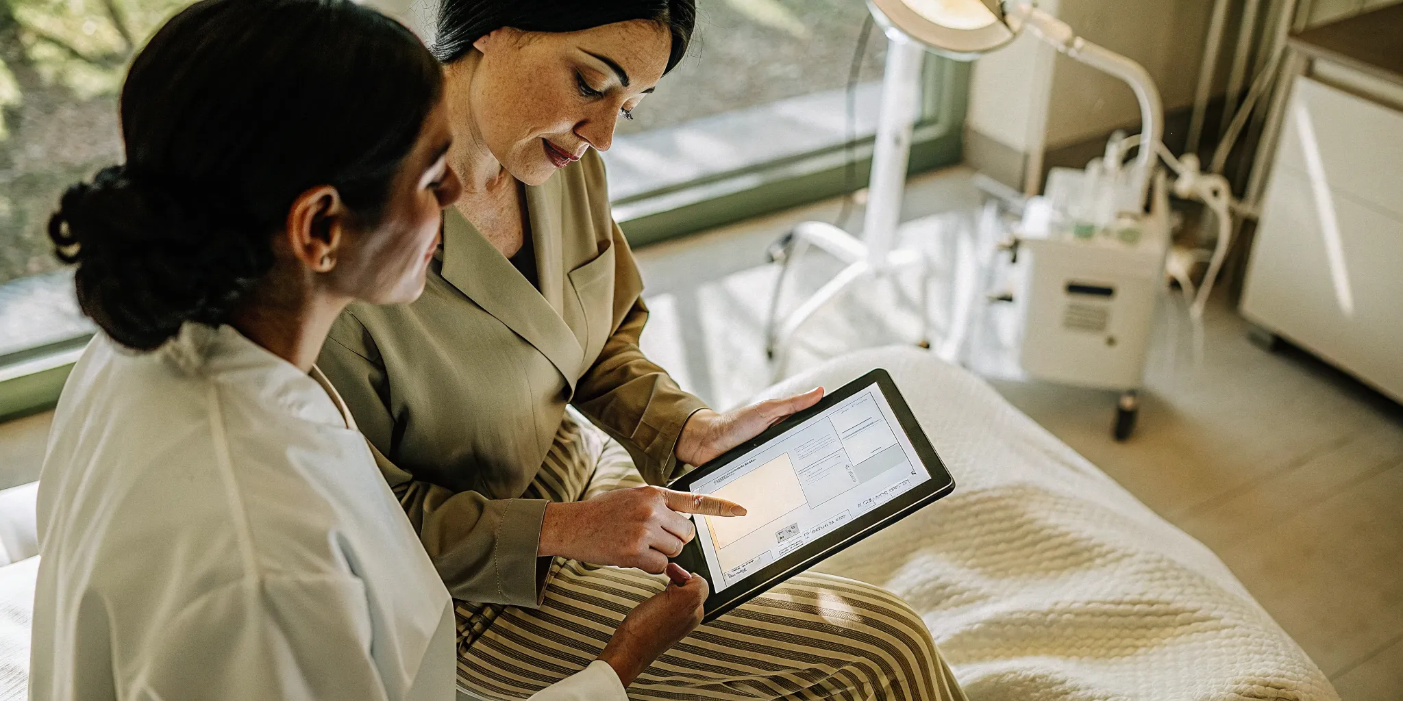 Clinical provider reviewing a personalized facial rejuvenation plan with a patient