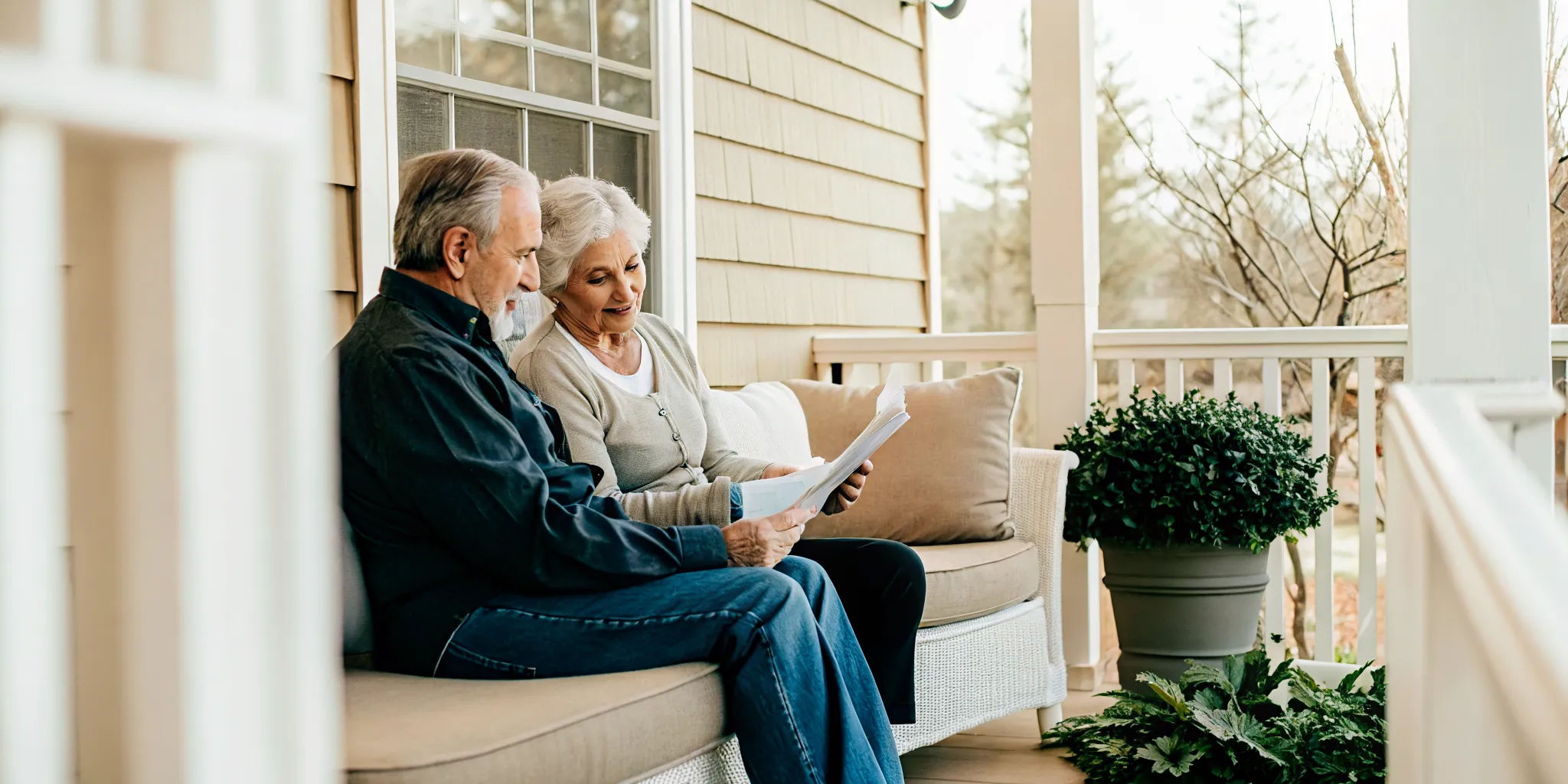 Older couple reviewing veterans benefit information on a Charlotte-area porch