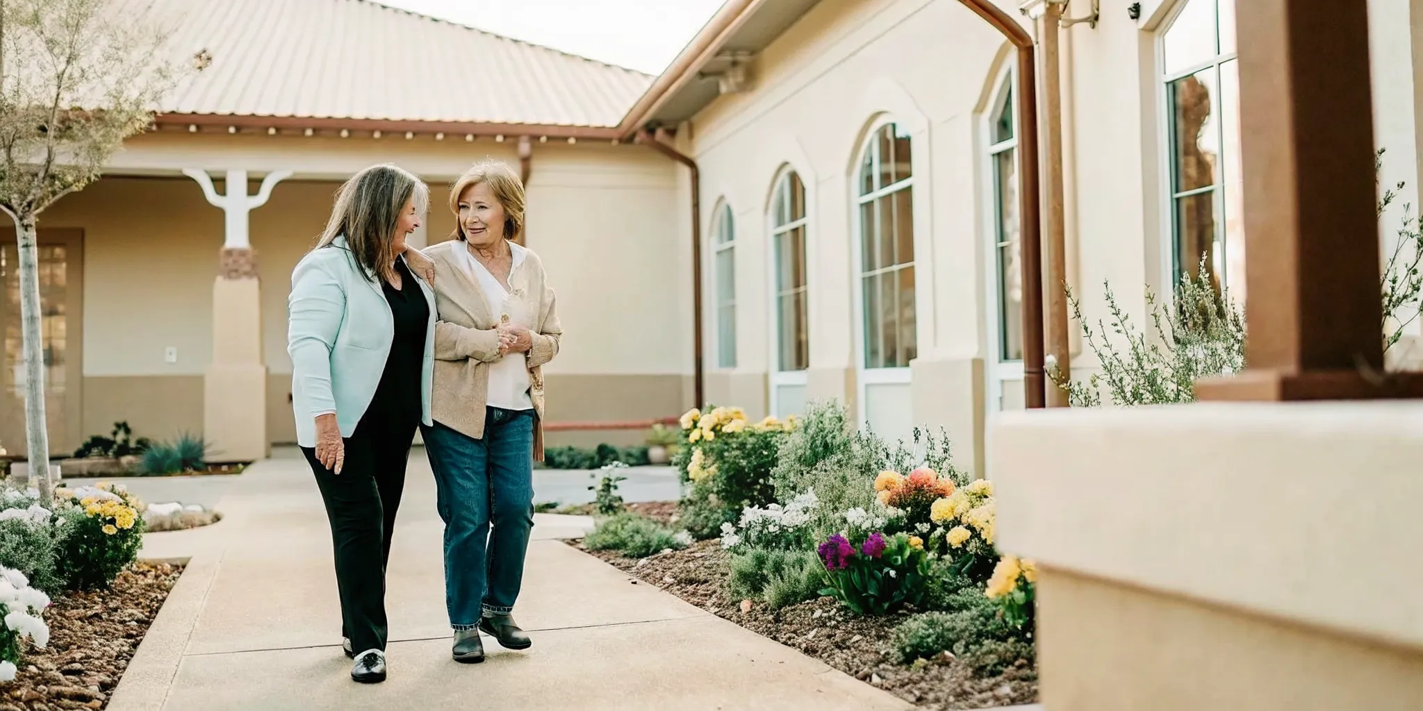 Mother and adult daughter touring an assisted living community near Fort Mill