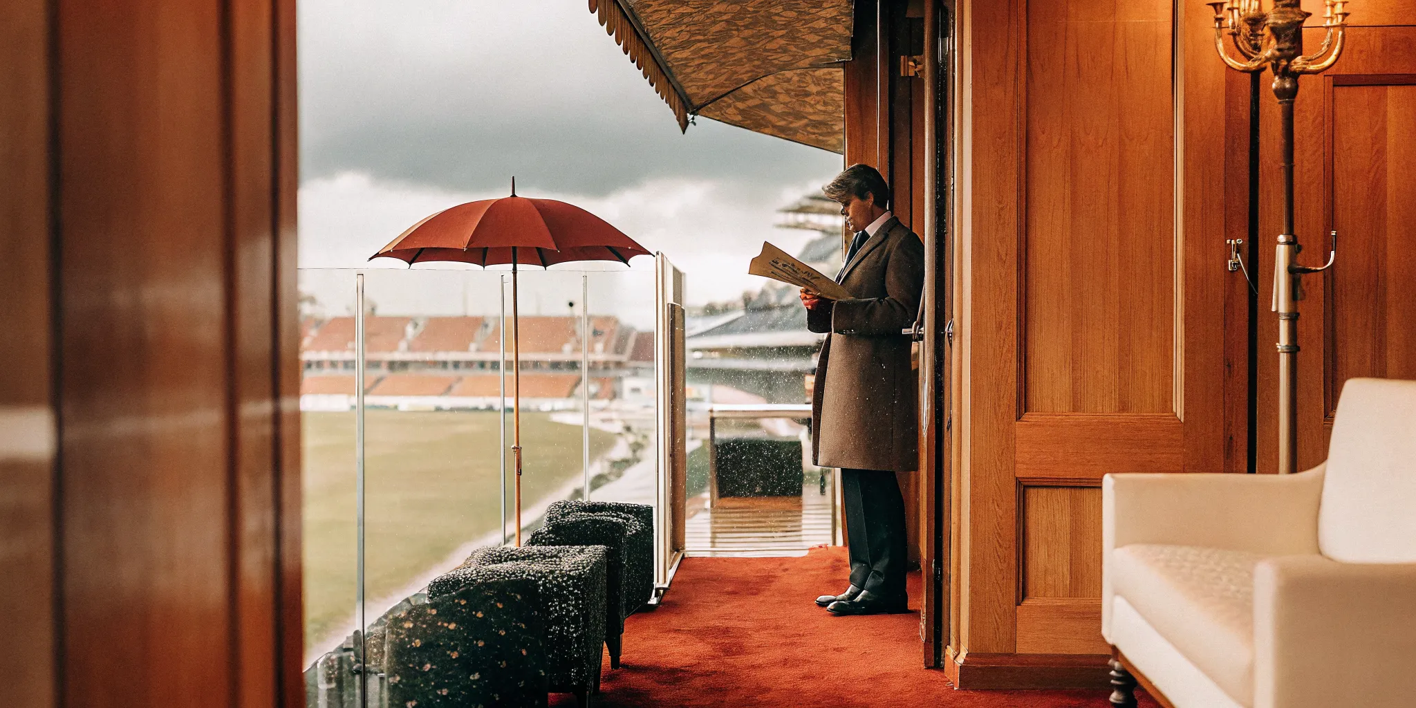 Executive concierge reviewing a sports event weather contingency plan