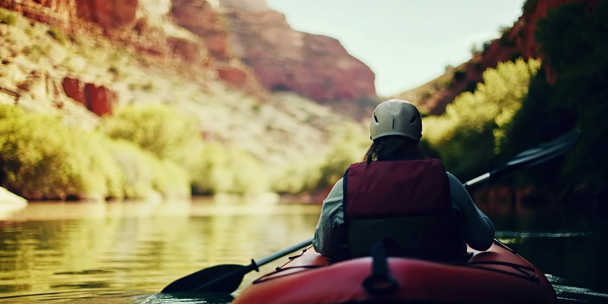 Single paddler preparing for duckie rafting Colorado at State Bridge