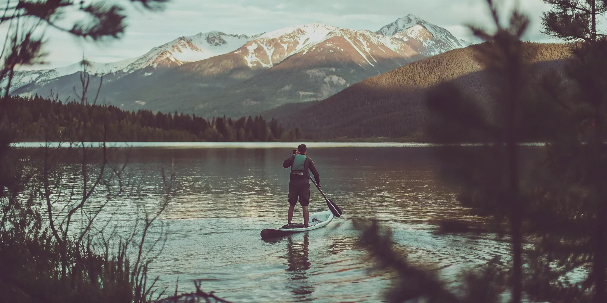 High altitude paddle boarding near shore on Lake Dillon