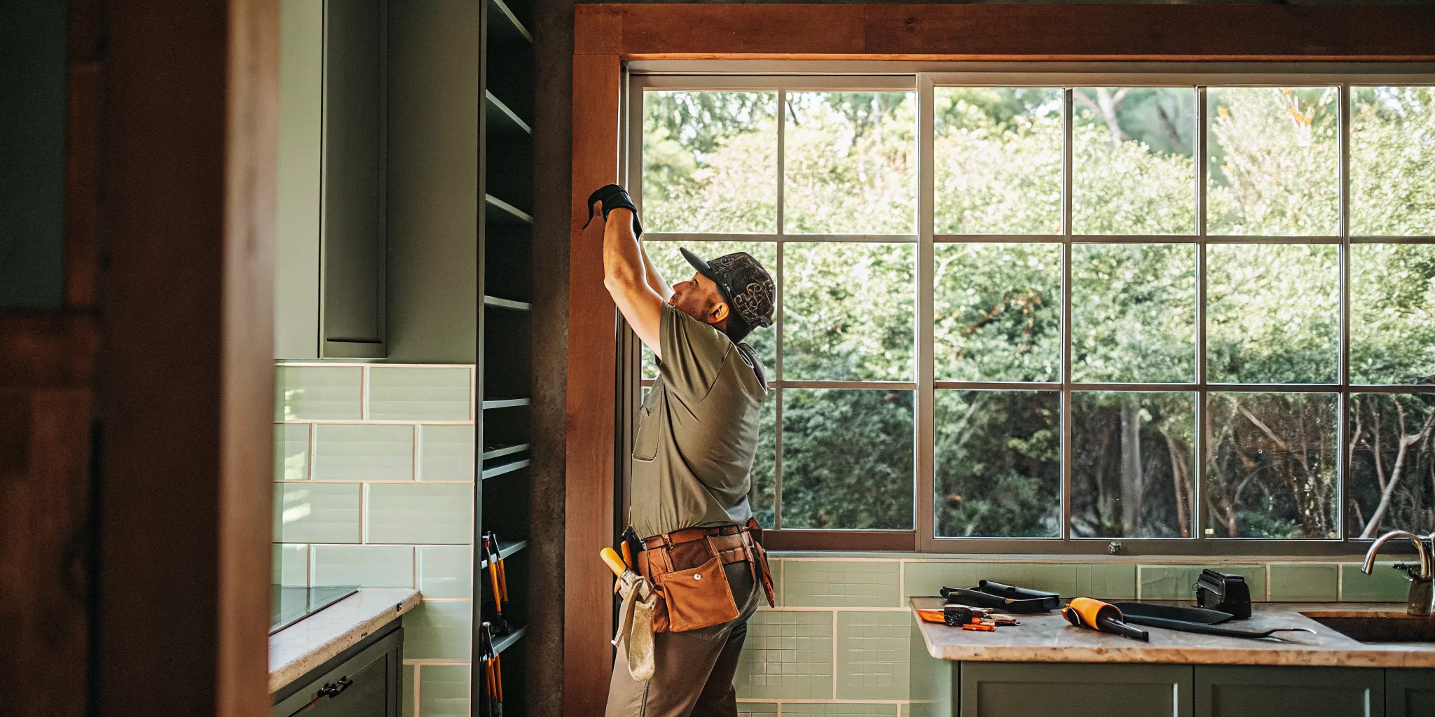 Electrician securing a fan-rated ceiling box and brace