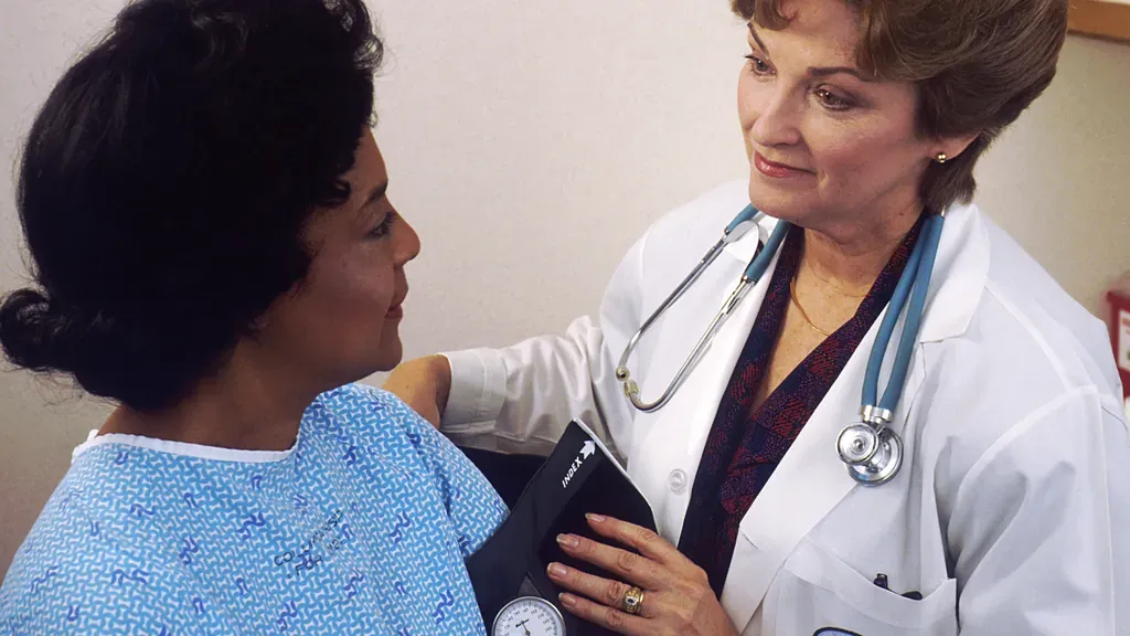 Clinician checking cardiovascular risk factors during an advanced heart health evaluation