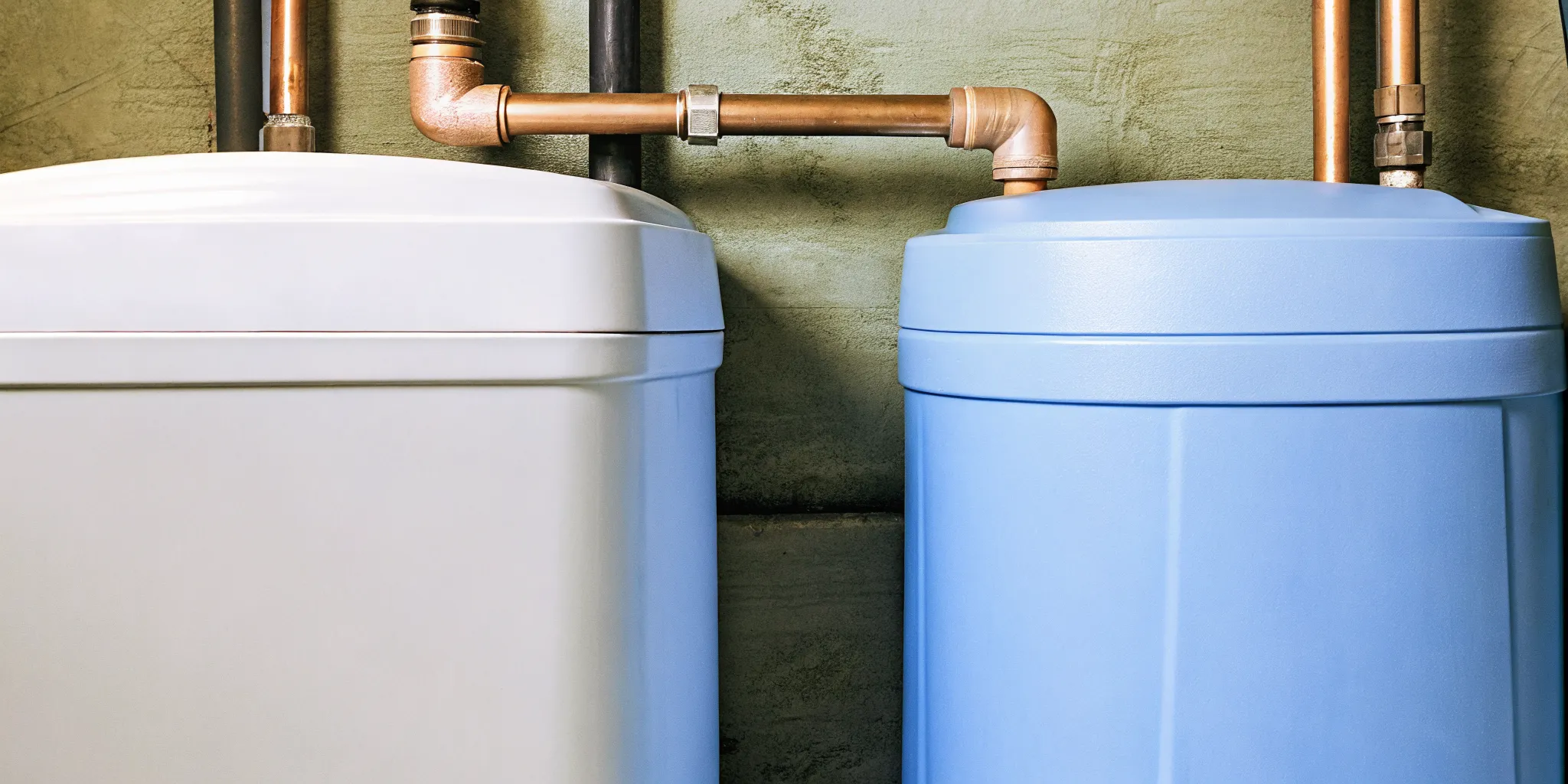 Whole-home water softener installed in a basement utility room