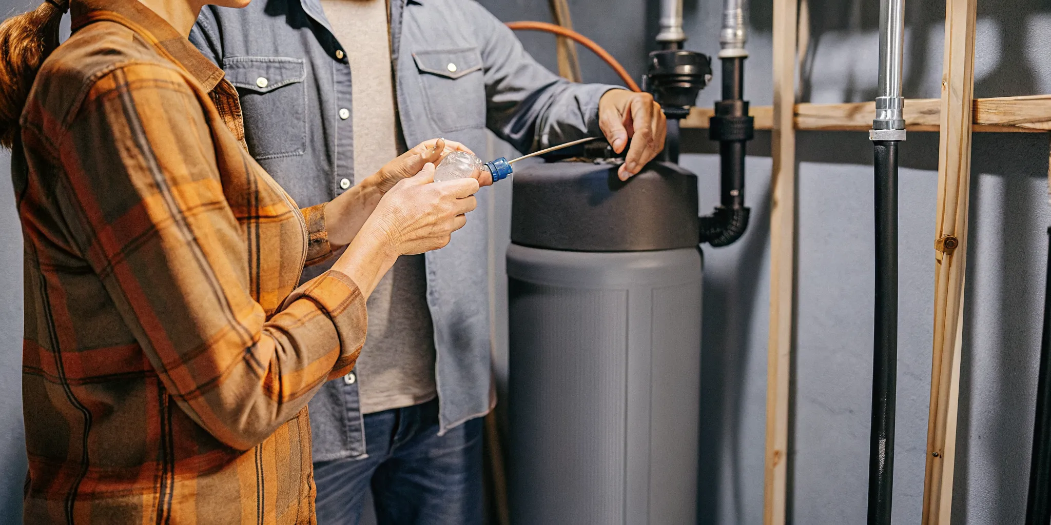 Water treatment specialist testing water before sizing a softener